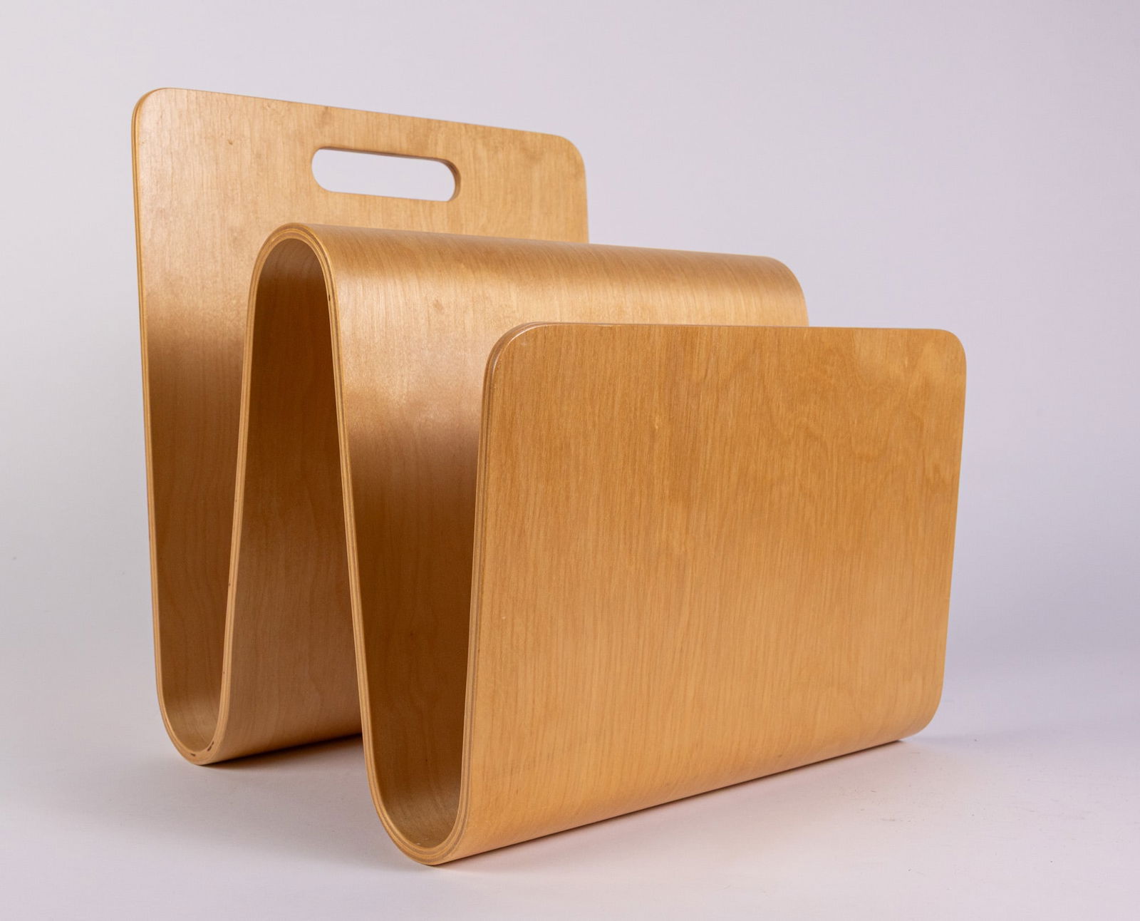 Eric Pfeiffer | Offi "W" Bentwood Magazine Stand: Designed c. 2000, blonde tone finished plywood. Marked: Offi Made in LatviaSize14" x 13" x 12"LiteratureBrooks Auction – Online Auction Terms & Conditions Contact: (856) 694-2960 |