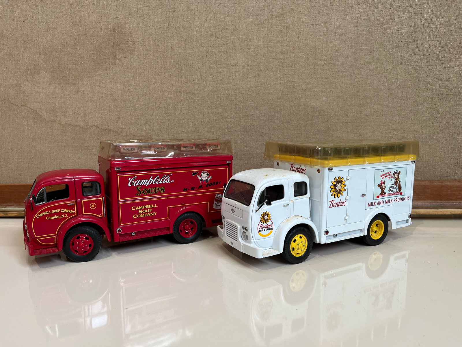Pair of Danbury Mint Delivery Trucks: Pair of Danbury Mint Delivery Trucks featuring Campbell's Soup and Borden'sLiteratureBrooks Auction – Online Auction Terms & Conditions Contact: (856) 694-2960 | info@brooks.auction READ BEFORE