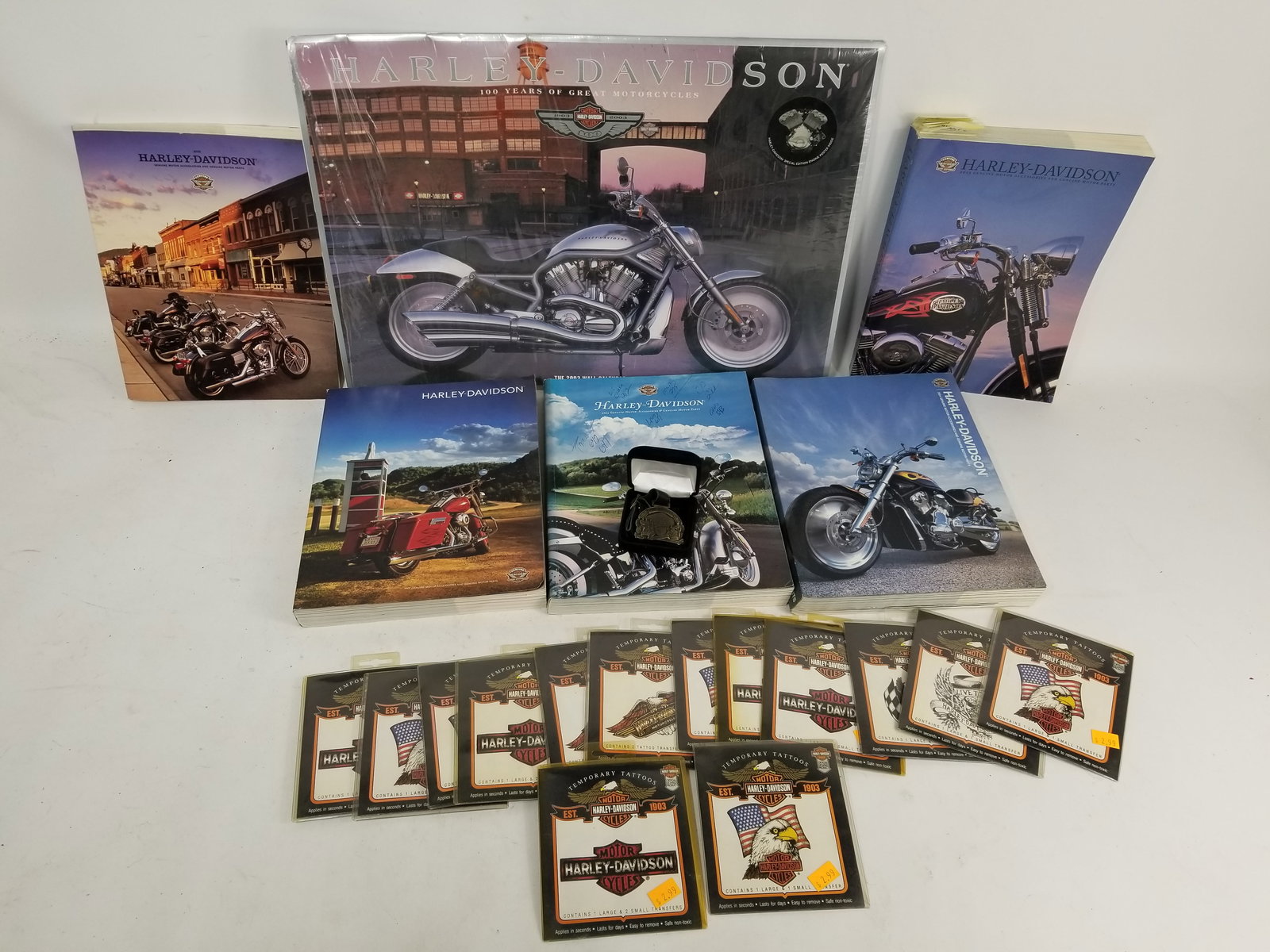 Assortment of Harley Davidson Merchandise: Assortment of Harley Davidson Merchandise featuring wall calendar, books and temporary tattoosLiteratureBrooks Auction – Online Auction Terms & Conditions Contact: (856) 694-2960 |