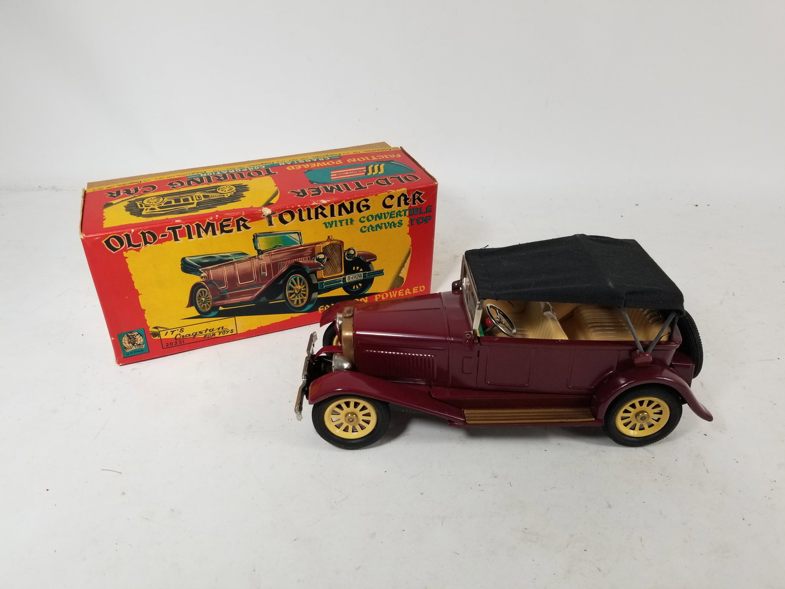 Shioji Cragstan Tin Friction Old-Timer Touring Car in Original Box: Shioji Cragstan Tin Friction Old-Timer Touring Car in Original Box Literature Brooks Auction – Online Auction Terms & Conditions Contact: (856) 694-2960 | info@brooks.auction READ BEFORE YOU BID