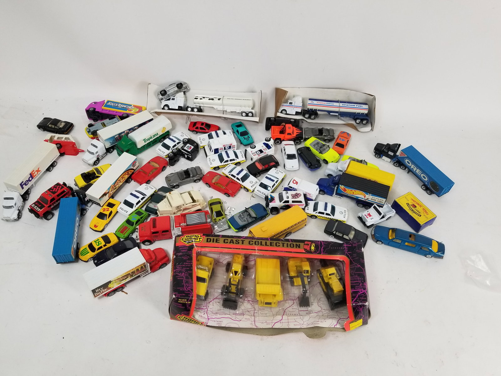 Assortment of Model and Toy Vehicles: Assortment of Model and Toy Vehicles featuring die cast Road Champs in original packaging Literature Brooks Auction – Online Auction Terms & Conditions Contact: (856) 694-2960 | info@brooks.auct