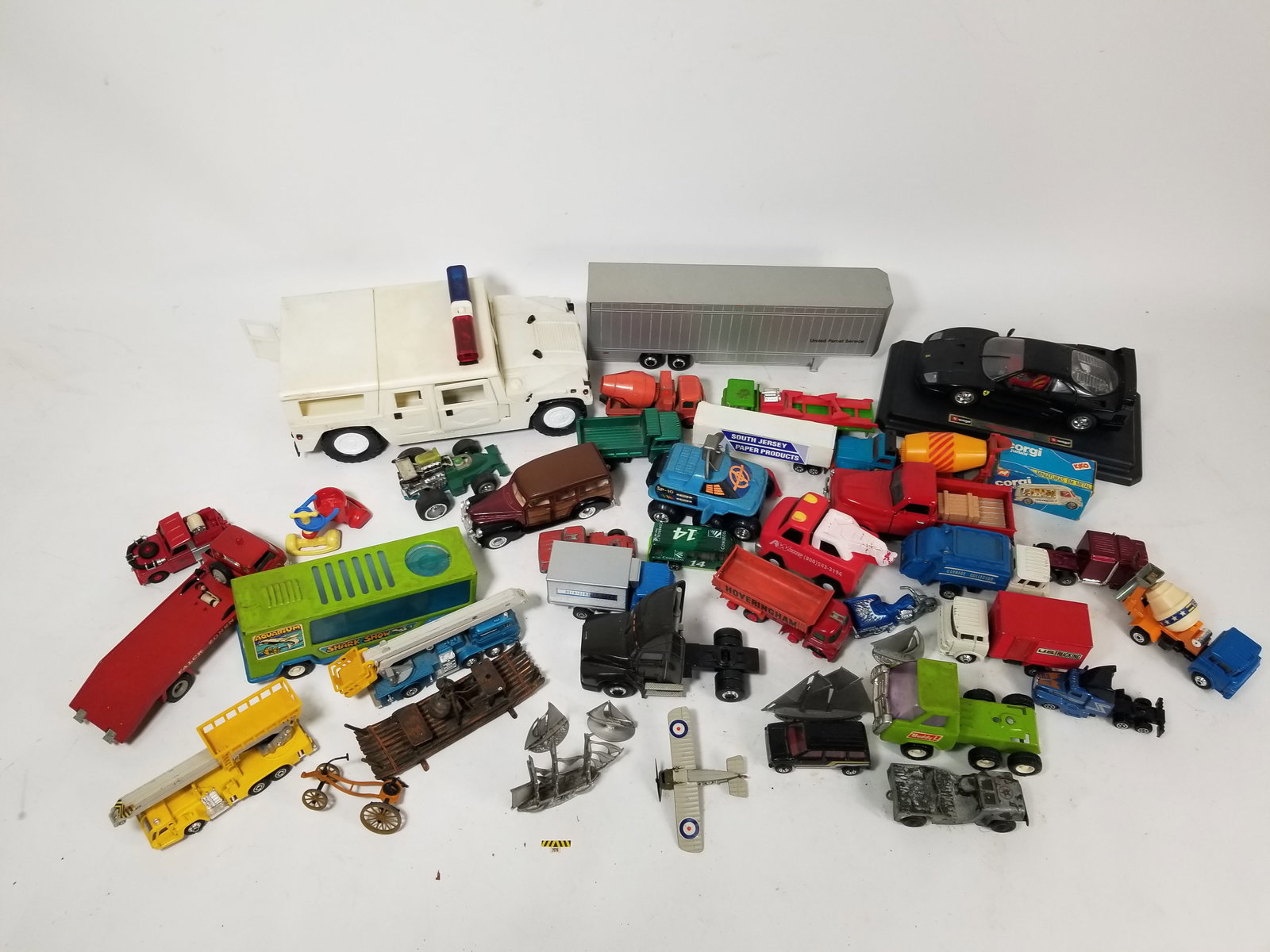 Assortment of Toy and Model Vehicles: Assortment of Toy and Model Vehicles featuring Bburago, Budd L and Shinsei Literature Brooks Auction – Online Auction Terms & Conditions Contact: (856) 694-2960 | info@brooks.auction READ BEFORE