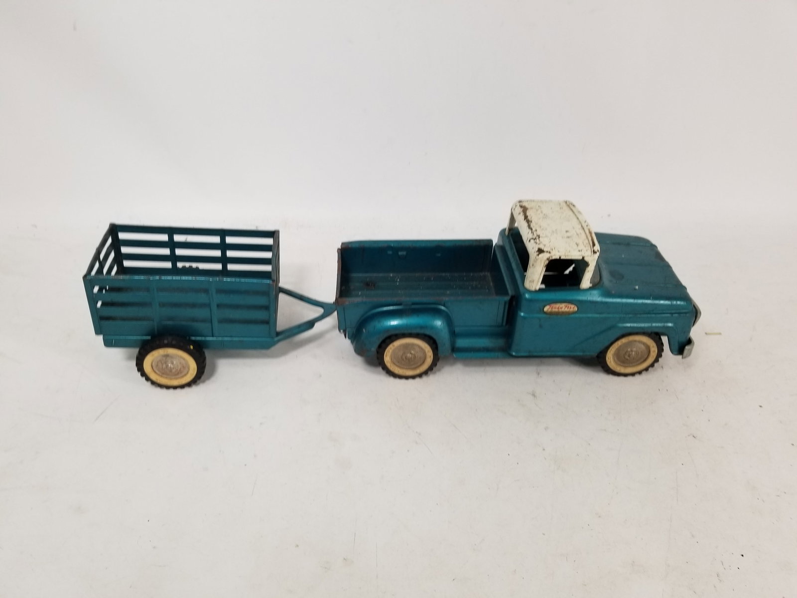 1950s-60s Tonka Pickup Truck and Trailer: 1950s-60s Tonka Pickup Truck and Trailer, connector on trailer broken Literature Brooks Auction – Online Auction Terms & Conditions Contact: (856) 694-2960 | info@brooks.auction READ BEFORE YOU