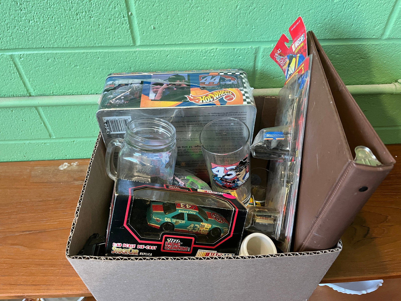 Nascar Racing Assortment: Nascar Racing Assortment featuring Richard Petty Memorabilia, trading cards and toy vehicles. Literature Brooks Auction – Online Auction Terms & Conditions Contact: (856) 694-2960 | info@brooks.