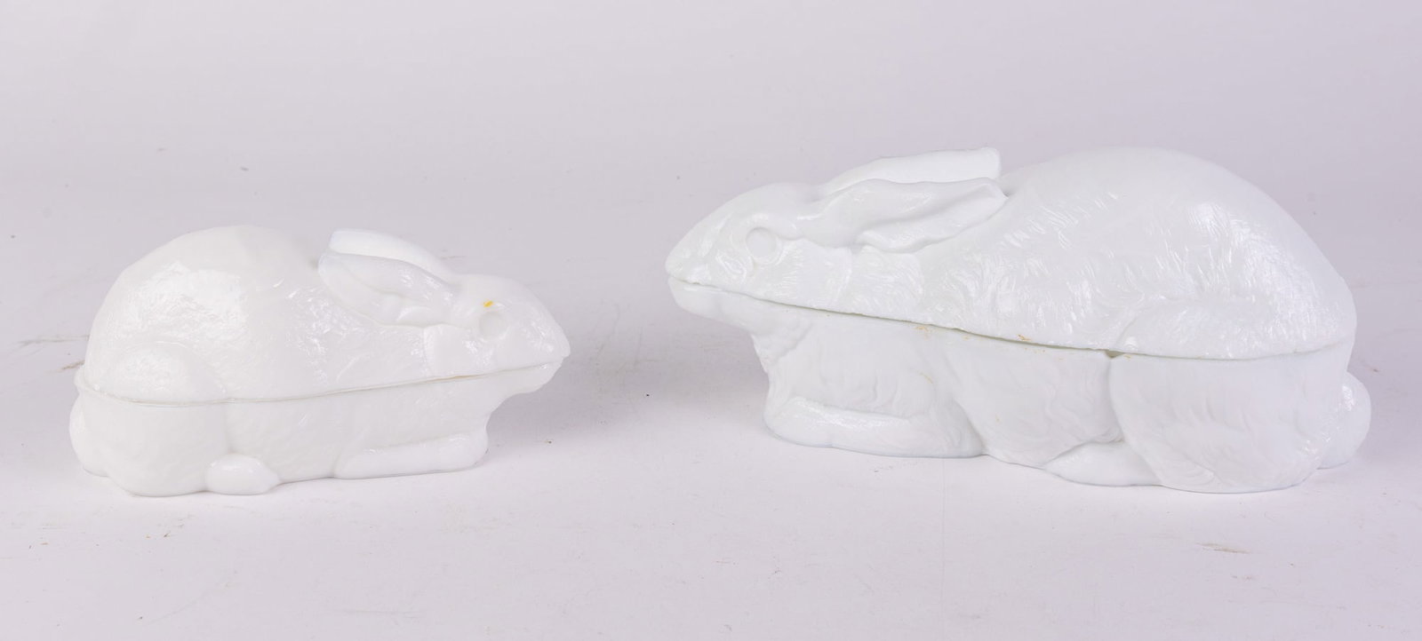 Two Rabbit Form Vintage Milk Glass Covered Dishes: Two Rabbit Form Vintage Milk Glass Covered DishesSize7" x 12" x 12"LiteratureBrooks Auction – Online Auction Terms & Conditions