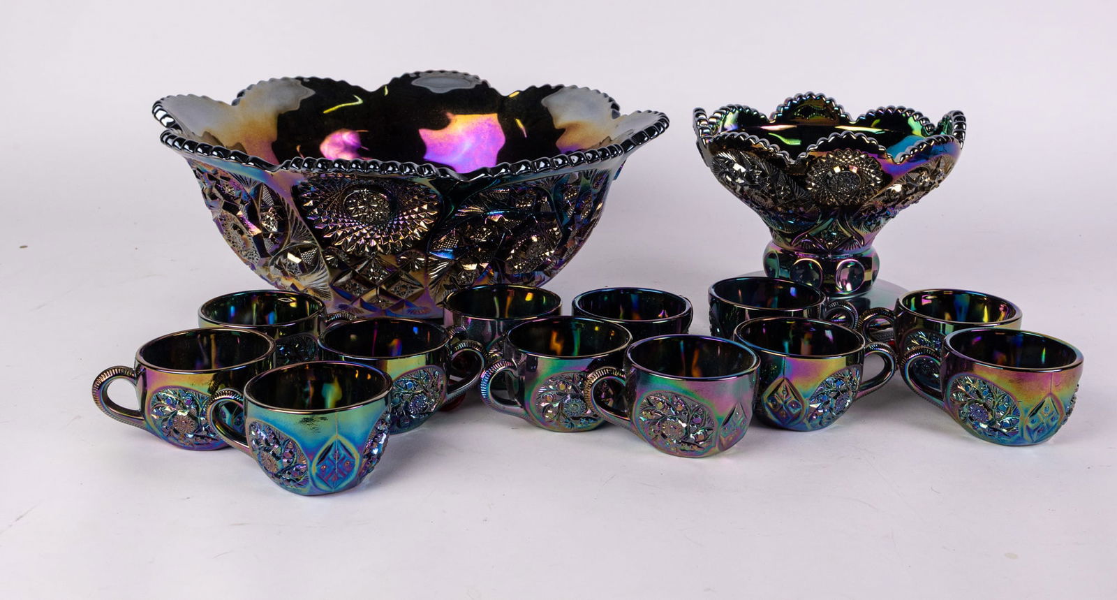 Blue Carnival Glass Punch Bowl Set: Blue Carnival Glass Punch Bowl SetSize8" x 16" diameterLiteratureBrooks Auction – Online Auction Terms & Conditions