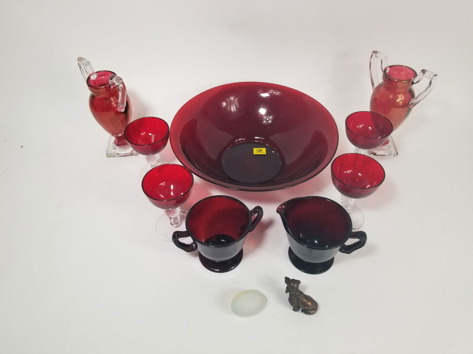 Vintage Ruby Glass Servingware: Vintage Ruby Glass ServingwareSize7" x 12" x 12"LiteratureBrooks Auction – Online Auction Terms & Conditions
