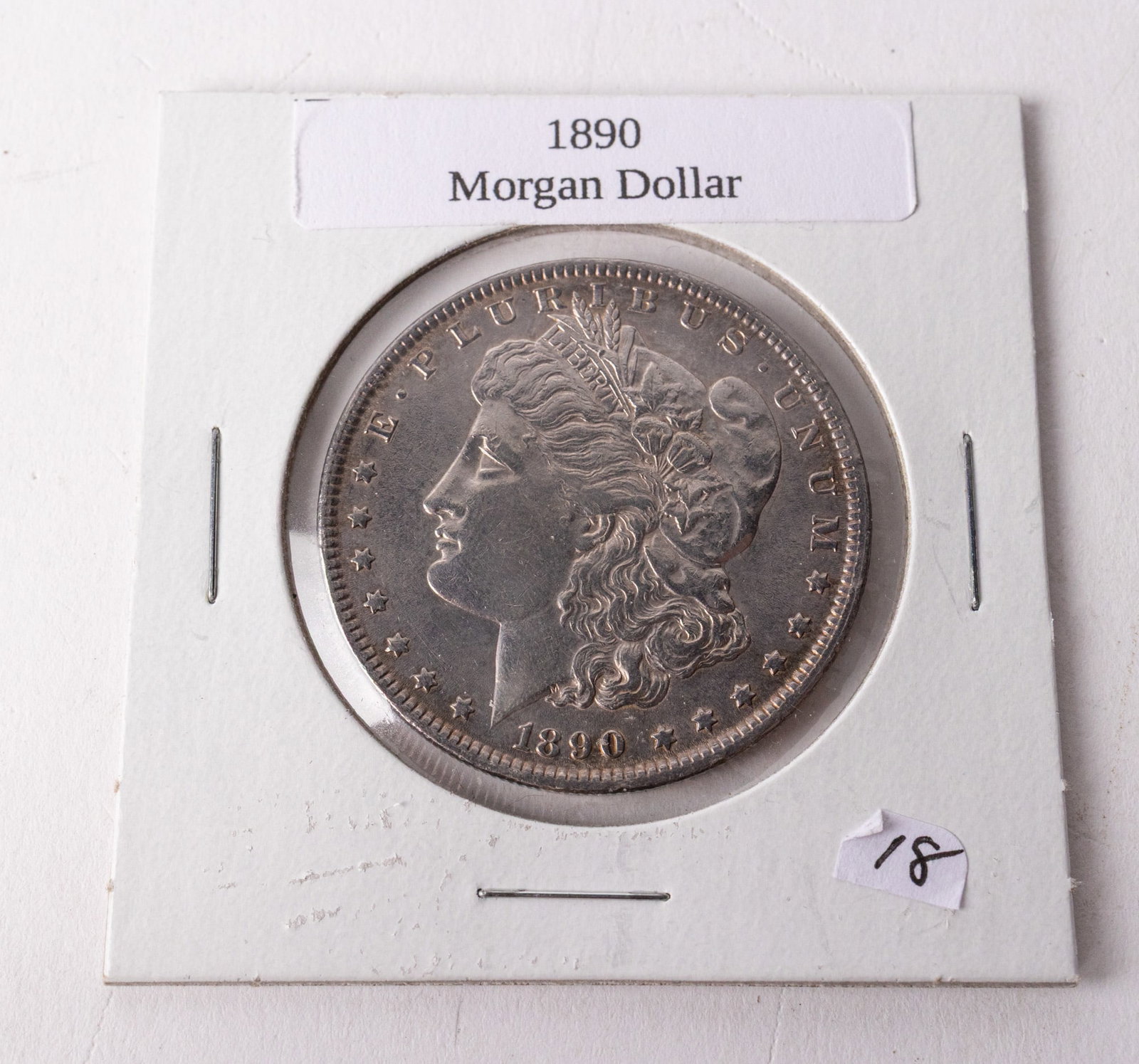 1890 Silver Morgan Dollar: 1890 Silver Morgan DollarLiteratureBrooks Auction – Online Auction Terms & Conditions