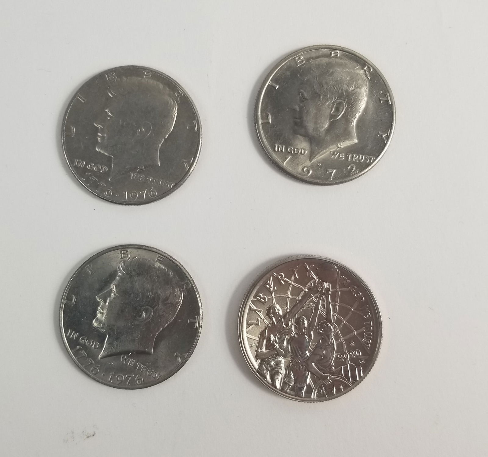 4 Half Dollars ft. Basketball Hall of Fame Commemorative half dollar.: 4 Half Dollars 1x 1972 2x 1976 Bicentennial design 1x BasketBall Hall of fame Commemorative half dollar Literature Brooks Auction – Online Auction Terms & Conditions ————