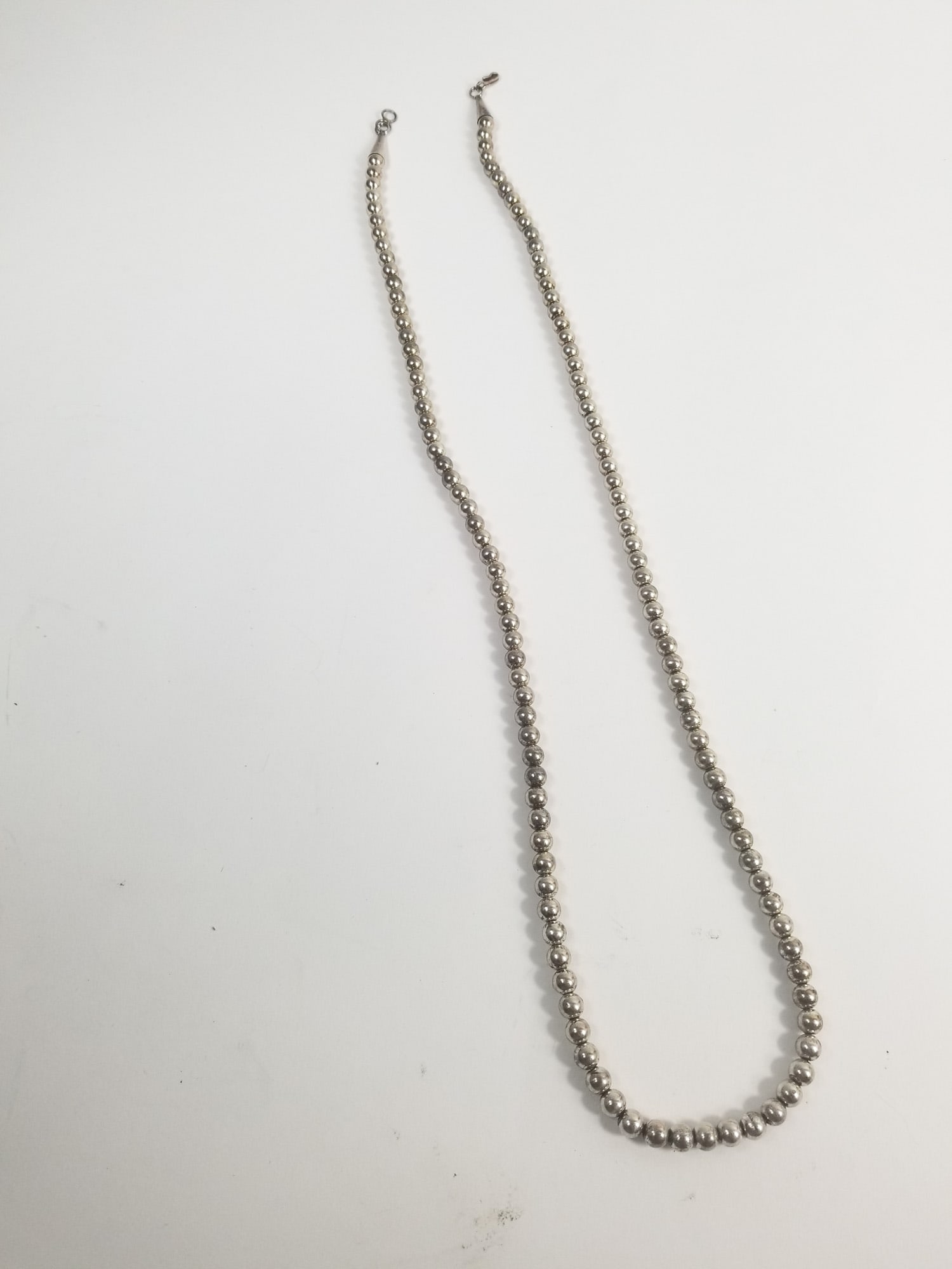 18" Native American Style Metal bead Necklace: 18" Native American Style Metal bead NecklaceLiteratureBrooks Auction – Online Auction Terms & Conditions