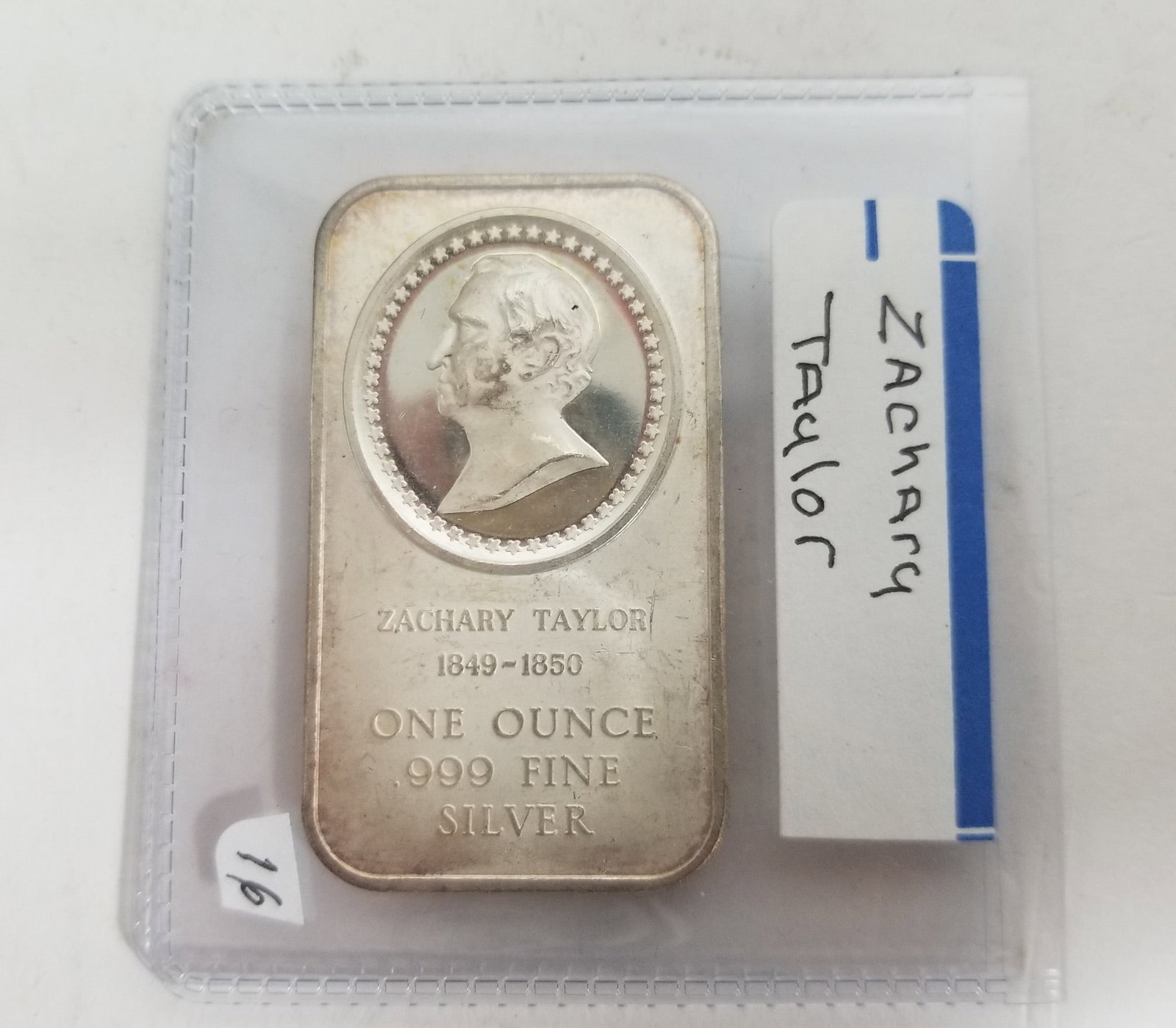Zachary Taylor 1oz. 999 Silver: 1976 Madison Mint FIne 1 ounce Silver Bar Commemorating the 12th POTUSLiteratureBrooks Auction – Online Auction Terms & Conditions Contact: (856) 694-2960 | info@brooks.auction READ BEFORE YOU