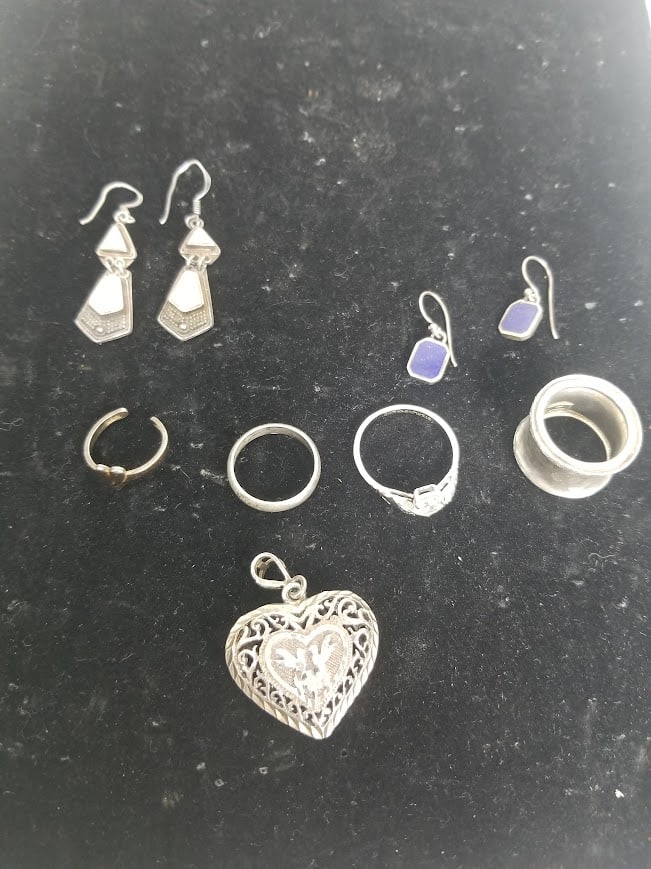 Earings and Rings Marked 925: Earings and Rings Marked 925 (4) RIngs, (2) Pairs of Earing , (1) Pendant Total weight 32.4gLiteratureBrooks Auction – Online Auction Terms & Conditions Contact: (856) 694-2960 |
