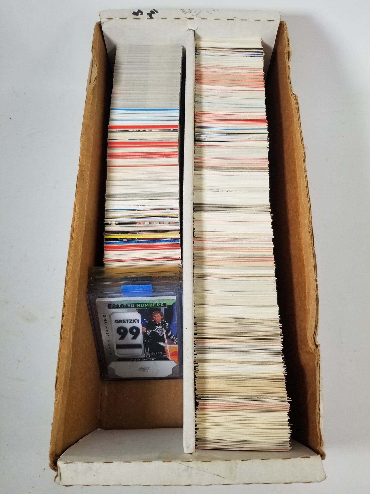 Large Assortment of Wayne Gretzky Cards: Large Assortment of Wayne Gretzky Cards featuring Black Diamond Retired Numbers Patch /99 and Tiffany set cards Size 15.5" x 7" x 4" Literature Brooks Auction – Online Auction Terms & Conditions