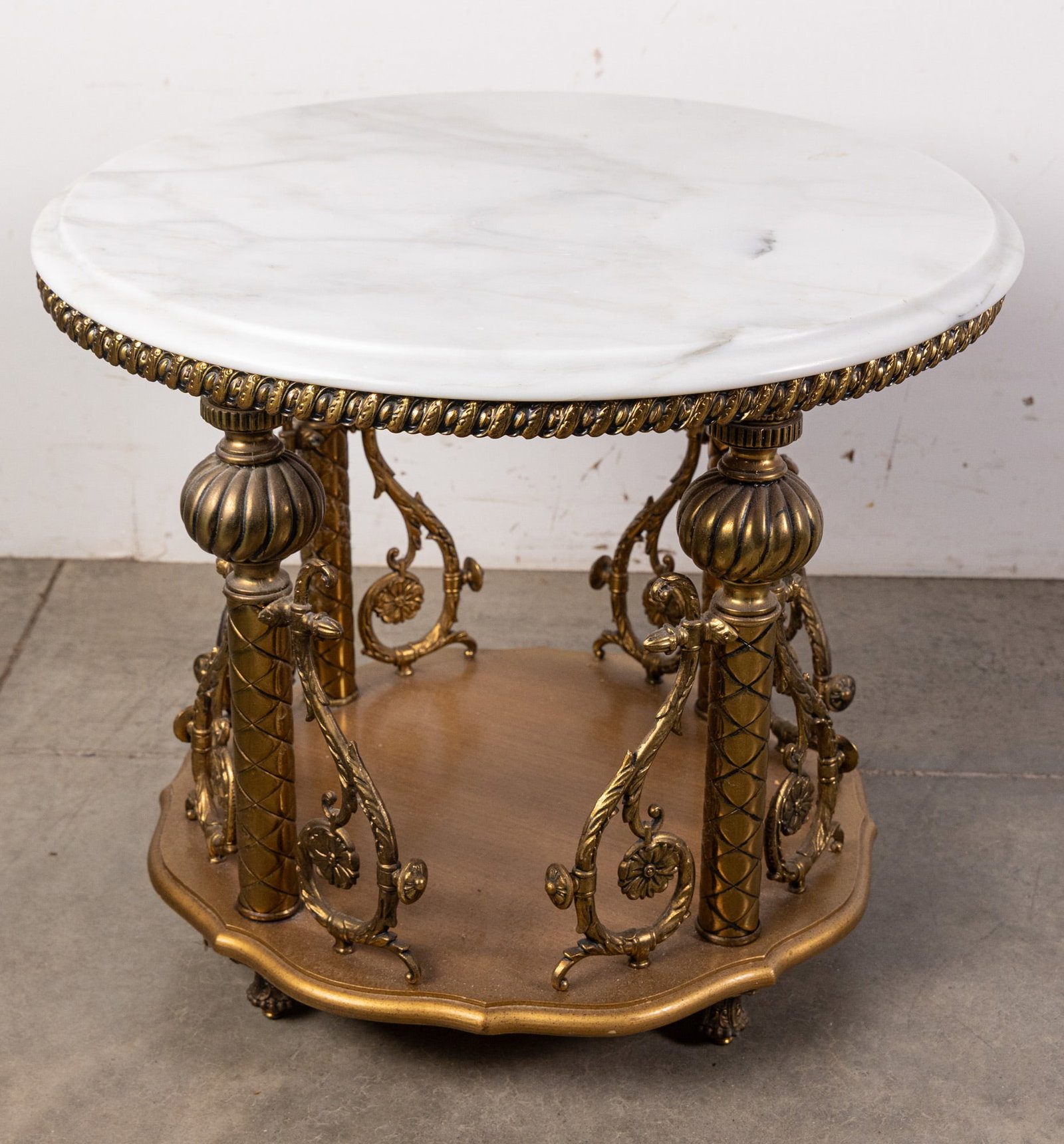 Vintage Ornate Hollywood Regency-style White Marble Top Table: Vintage Ornate Hollywood Regency-style White Marble Top Table Size 21" x 24" x 24" Literature Brooks Auction – Online Auction Terms & Conditions Contact: (856) 694-2960 | info@brooks.auction