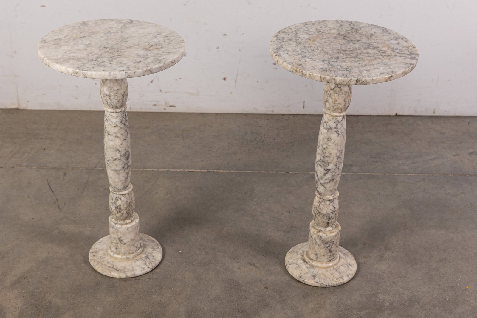 Pair of Italian White Marble Pedestal Tables: Pair of Italian White Marble Pedestal Tables Size 22" x 12" x 12" Literature Brooks Auction – Online Auction Terms & Conditions Contact: (856) 694-2960 | info@brooks.auction READ BEFORE YOU