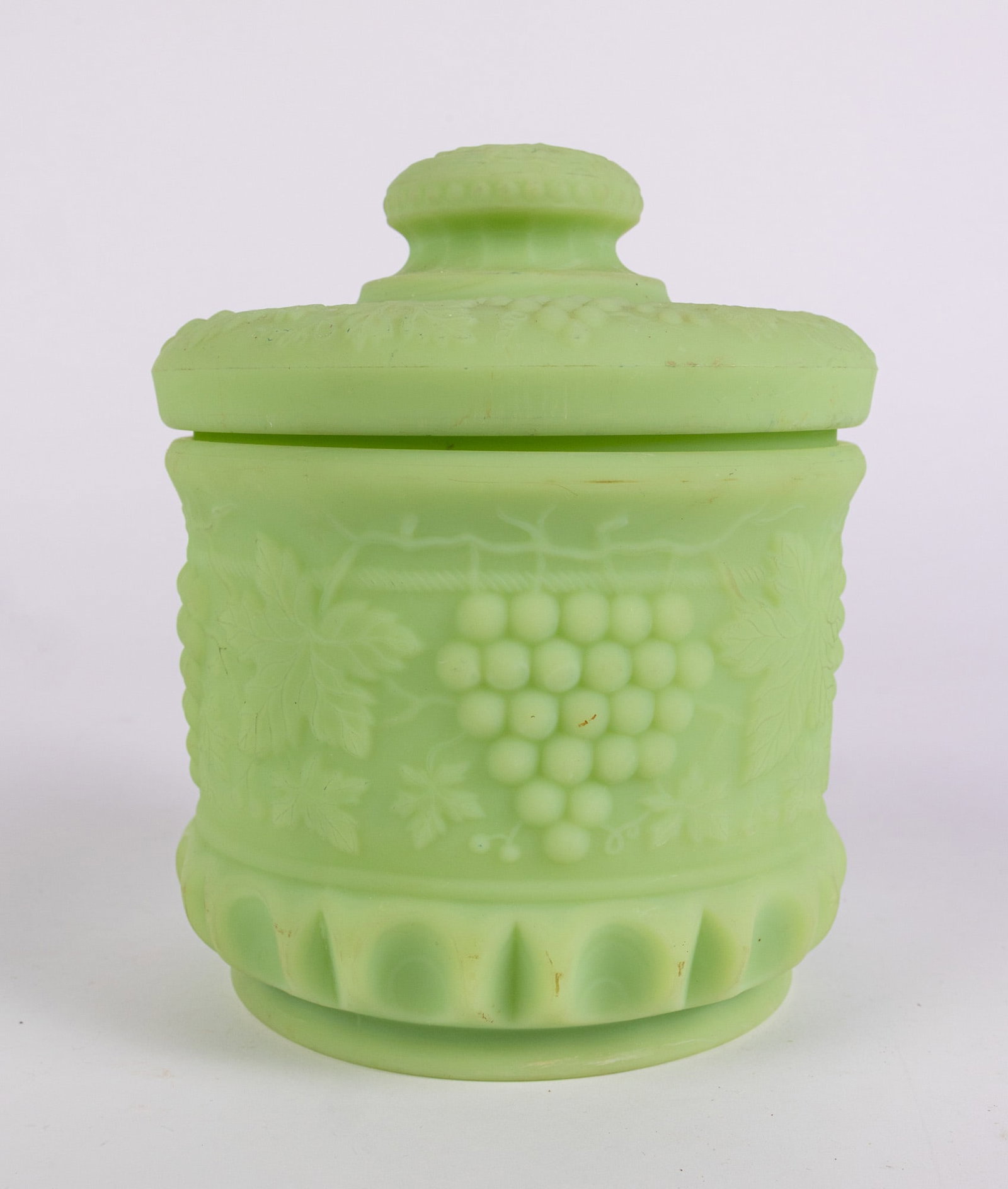 Fenton Grape and Cable Satin Custard Uranium Humidor/Tobacco Jar: Fenton Grape and Cable Satin Custard Uranium Humidor/Tobacco Jar Size 8" x 7" x 7" Literature Brooks Auction – Online Auction Terms & Conditions Contact: (856) 694-2960 | info@brooks.auction