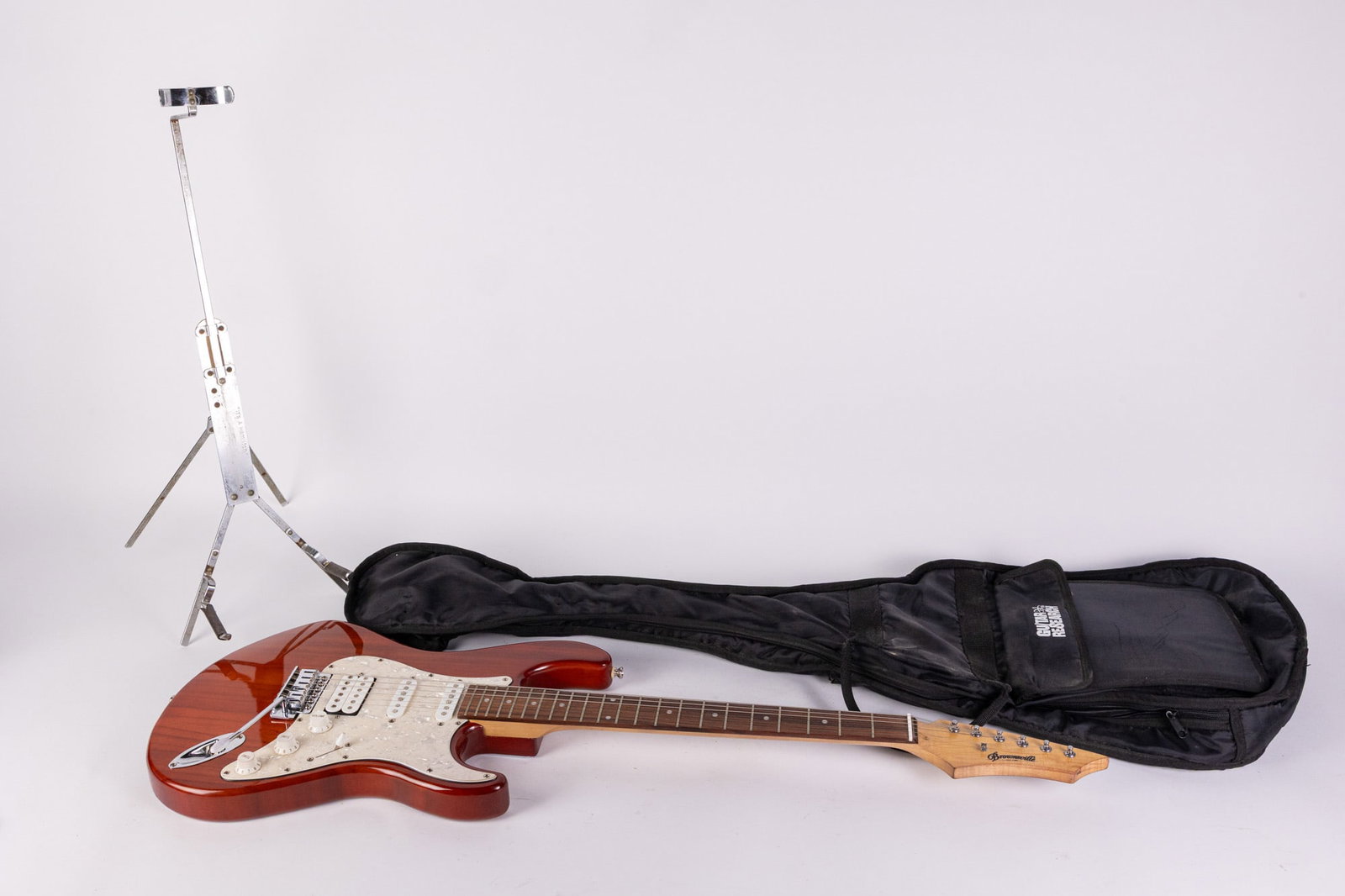 Vintage Brownsville Strat Electric Guitar w/ Soft Case & Stand: Vintage Brownsville Strat Electric Guitar w/ Soft Case & Stand Size 40" H Literature Brooks Auction – Online Auction Terms & Conditions Contact: (856) 694-2960 | info@brooks.auction READ BEFORE