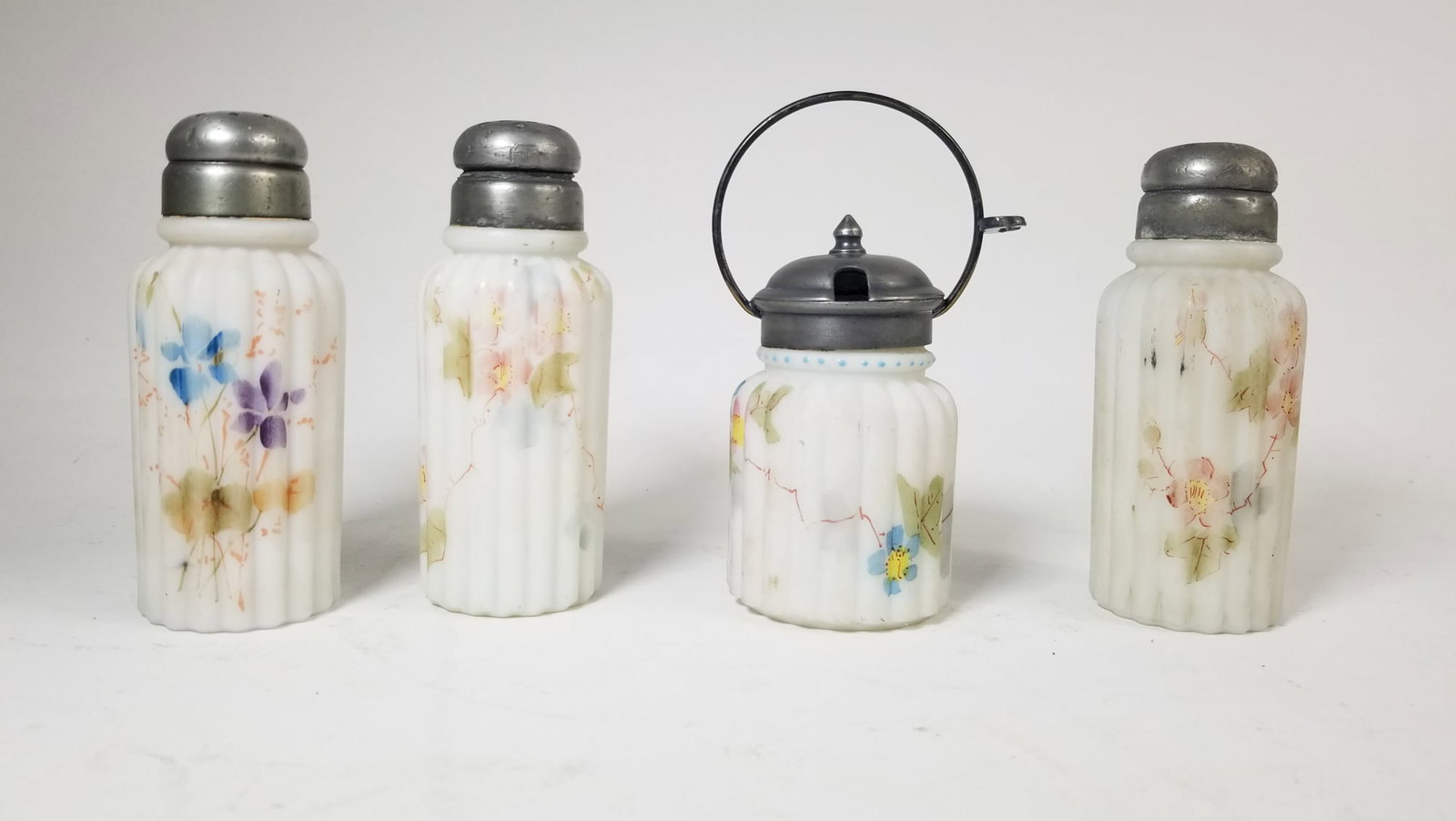 Set of Four Mt. Washington Shakers: Set of Four Mt. Washington Shakers Size 7" x 12" x 12" Literature Brooks Auction – Online Auction Terms & Conditions Contact: (856) 694-2960 | info@brooks.auction READ BEFORE YOU BID: We want