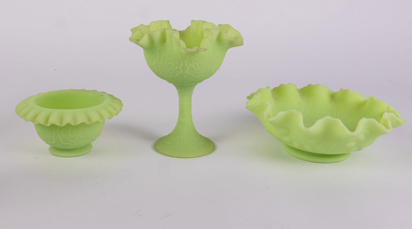 Three Pieces of Fenton Uranium Satin Custard Glass: Three Pieces of Fenton Uranium Satin Custard Glass Size 3" x 8" x 8" Literature Brooks Auction – Online Auction Terms & Conditions Contact: (856) 694-2960 | info@brooks.auction READ BEFORE YOU