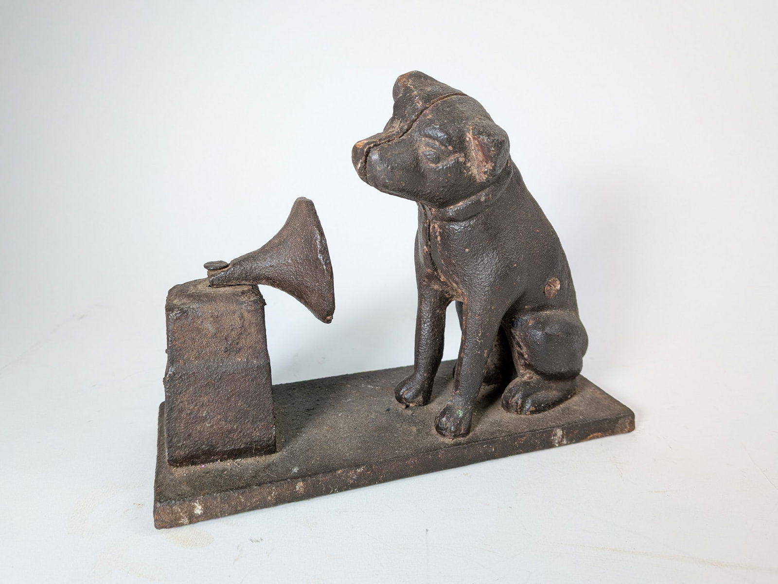 Nipper "His Master's Voice" Cast Iron Still Bank: Nipper "His Master's Voice" Cast Iron Still Bank Size 7" x 3" x 8" Literature Brooks Auction – Online Auction Terms & Conditions Contact: (856) 694-2960 | info@brooks.auction READ BEFORE YOU