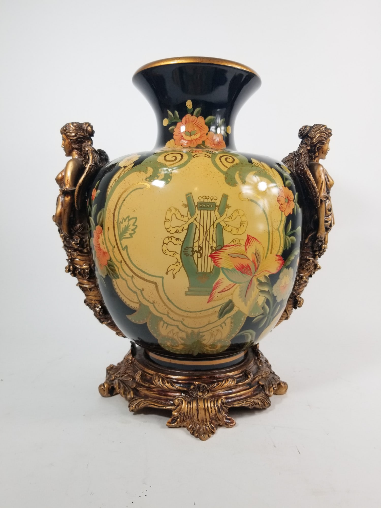 Gilt Angel Handle Figural Urn Vase: Gilt Angel Handle Figural Urn Vase Size 17" H Literature Brooks Auction – Online Auction Terms & Conditions Contact: (856) 694-2960 | info@brooks.auction READ BEFORE YOU BID: We want you to