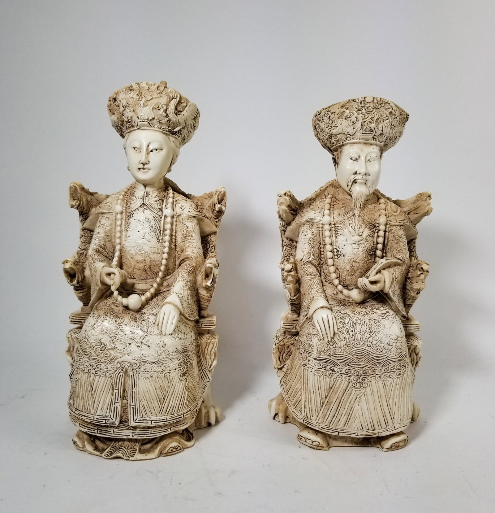 A Pair of Vintage Chinese Carved Resin Emperor & Empress Figures: A Pair of Vintage Chinese Carved Resin Emperor & Empress Figures Literature Brooks Auction – Online Auction Terms & Conditions Contact: (856) 694-2960 | info@brooks.auction READ BEFORE YOU BID: