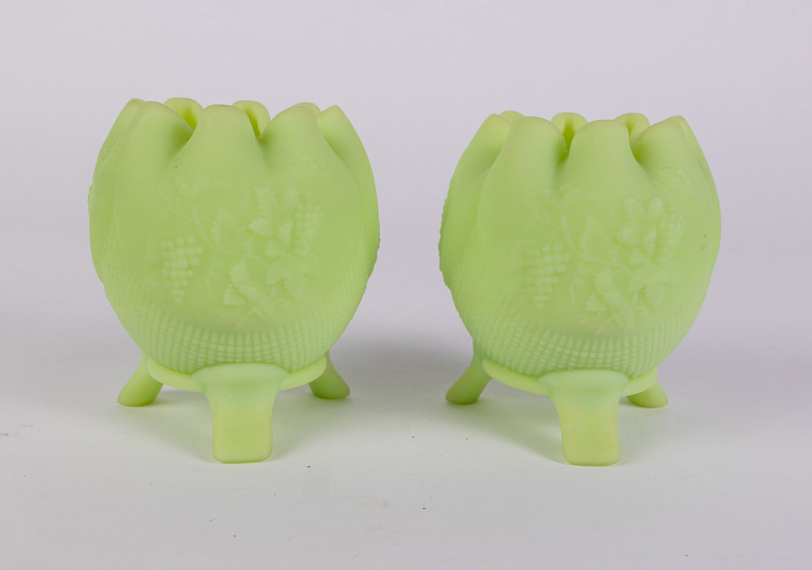 Pair of Fenton Uranium Satin Custard Glass Rose Bowls: Pair of Fenton Uranium Satin Custard Glass Rose Bowls Size 4.5" x 4" x 4" Literature Brooks Auction – Online Auction Terms & Conditions Contact: (856) 694-2960 | info@brooks.auction READ BEFORE