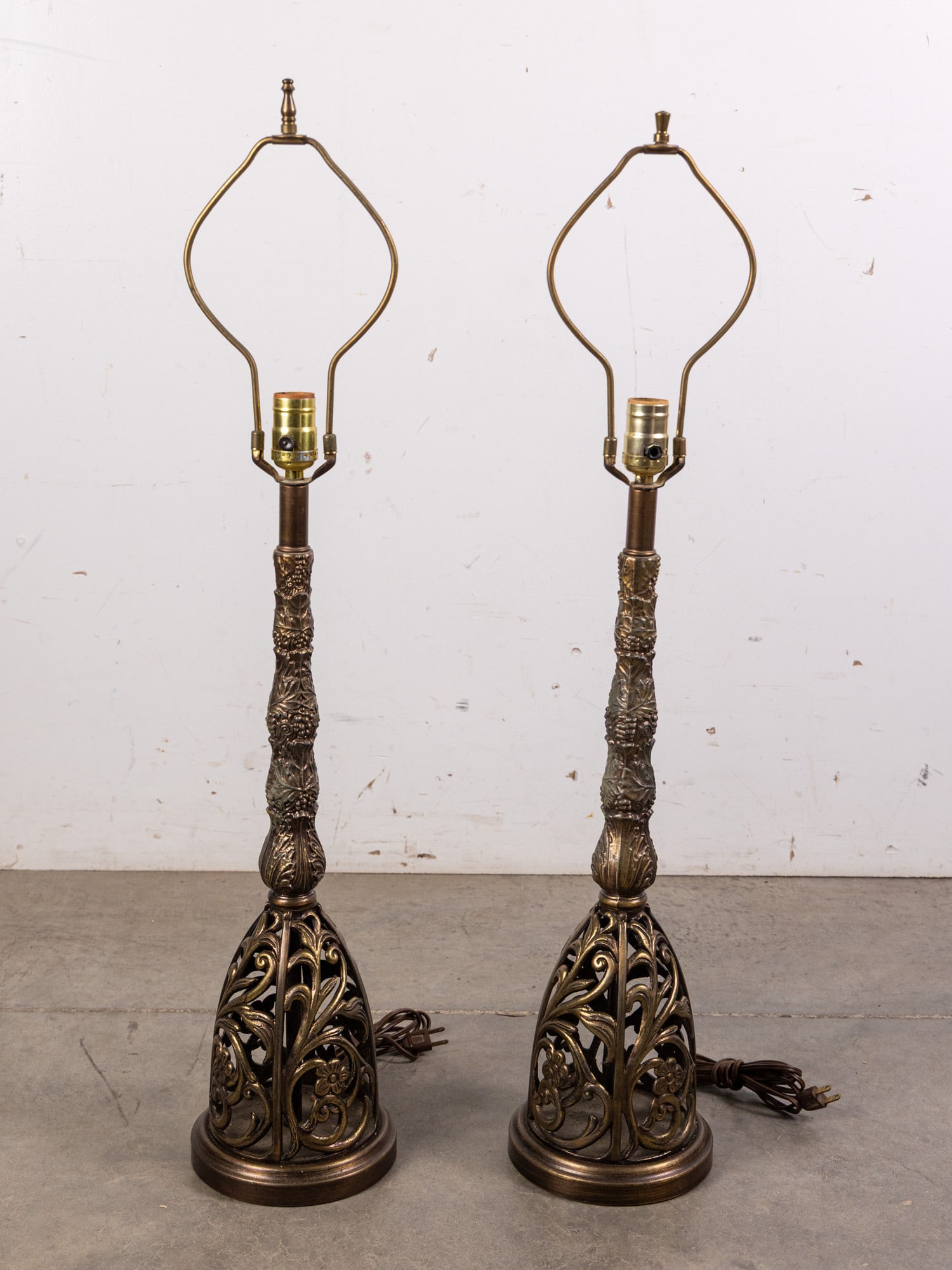 Pair of Ornate Filigree Cast Metal Table Lamps: Pair of Ornate Filigree Cast Metal Table Lamps Size 34" H Literature Brooks Auction – Online Auction Terms & Conditions Contact: (856) 694-2960 | info@brooks.auction READ BEFORE YOU BID: