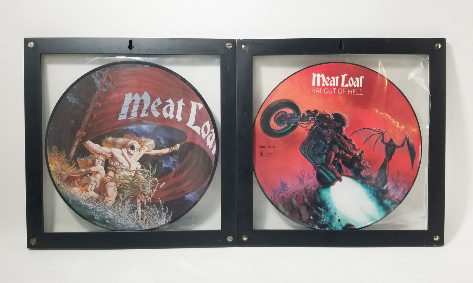 Two Meatloaf Framed Vinyl Record Picture Discs: Two Meatloaf Framed Vinyl Record Picture Discs Size 14" x 14" Literature Brooks Auction – Online Auction Terms & Conditions Contact: (856) 694-2960 | info@brooks.auction READ BEFORE YOU BID: