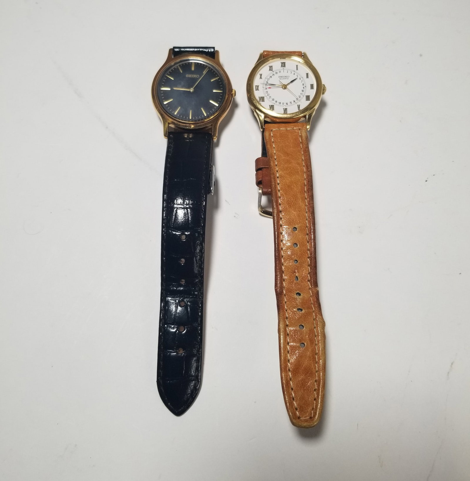 Two Seiko quartz Gold Tone Vintage Watches In Leather Bands: Two Seiko quartz Gold Tone Vintage Watches In Leather Bands Literature Brooks Auction – Online Auction Terms & Conditions Contact: (856) 694-2960 | info@brooks.auction READ BEFORE YOU BID: We