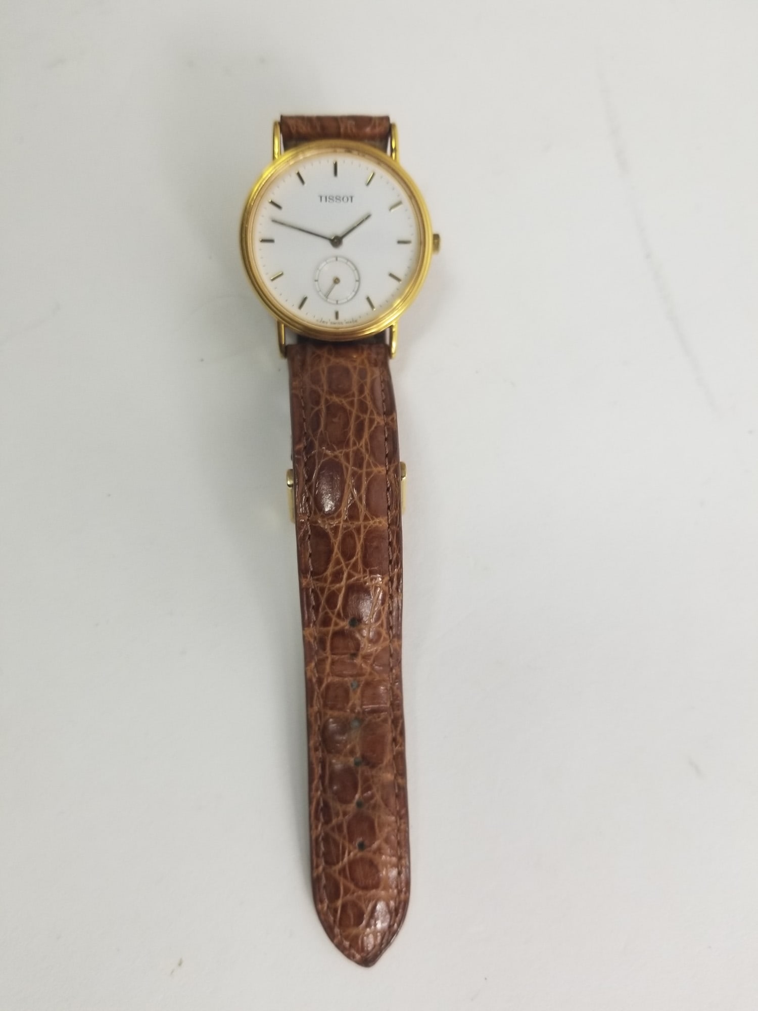 Tissot Gold tone White Dial with Smaller Second Hand Dial: Tissot Gold tone White Dial with Smaller Second Hand Dial Literature Brooks Auction – Online Auction Terms & Conditions Contact: (856) 694-2960 | info@brooks.auction READ BEFORE YOU BID: We