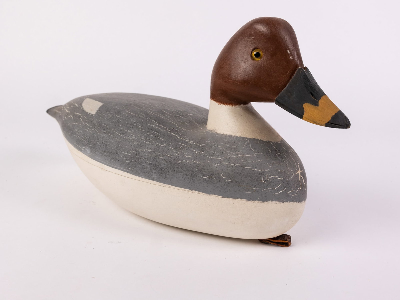 Jim Gale (1899 - 1971) Brigantine, NJ | Goldeneye Hen Duck Decoy: The base has an applied lead weight which is marked "J A GALE". Featuring glass inset eyes & hand painted detailing. Size 7" x 6" x 13" Literature Brooks Auction – Online Auction Terms & Conditi