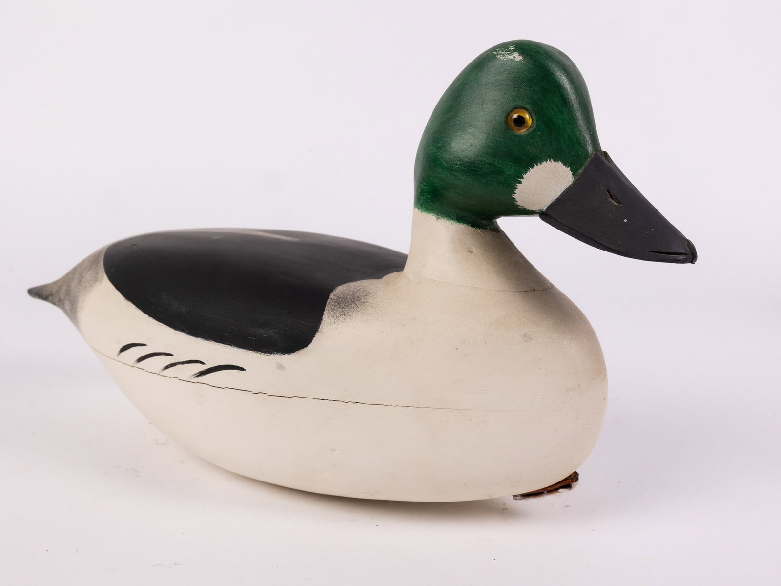 Jim Gale (1899 - 1971) Brigantine, NJ | Goldeneye Drake Duck Decoy: The base has an applied lead weight which is marked "J A GALE". Featuring glass inset eyes & hand painted detailing. Size 8" x 6" x 13" Literature Brooks Auction – Online Auction Terms & Conditi