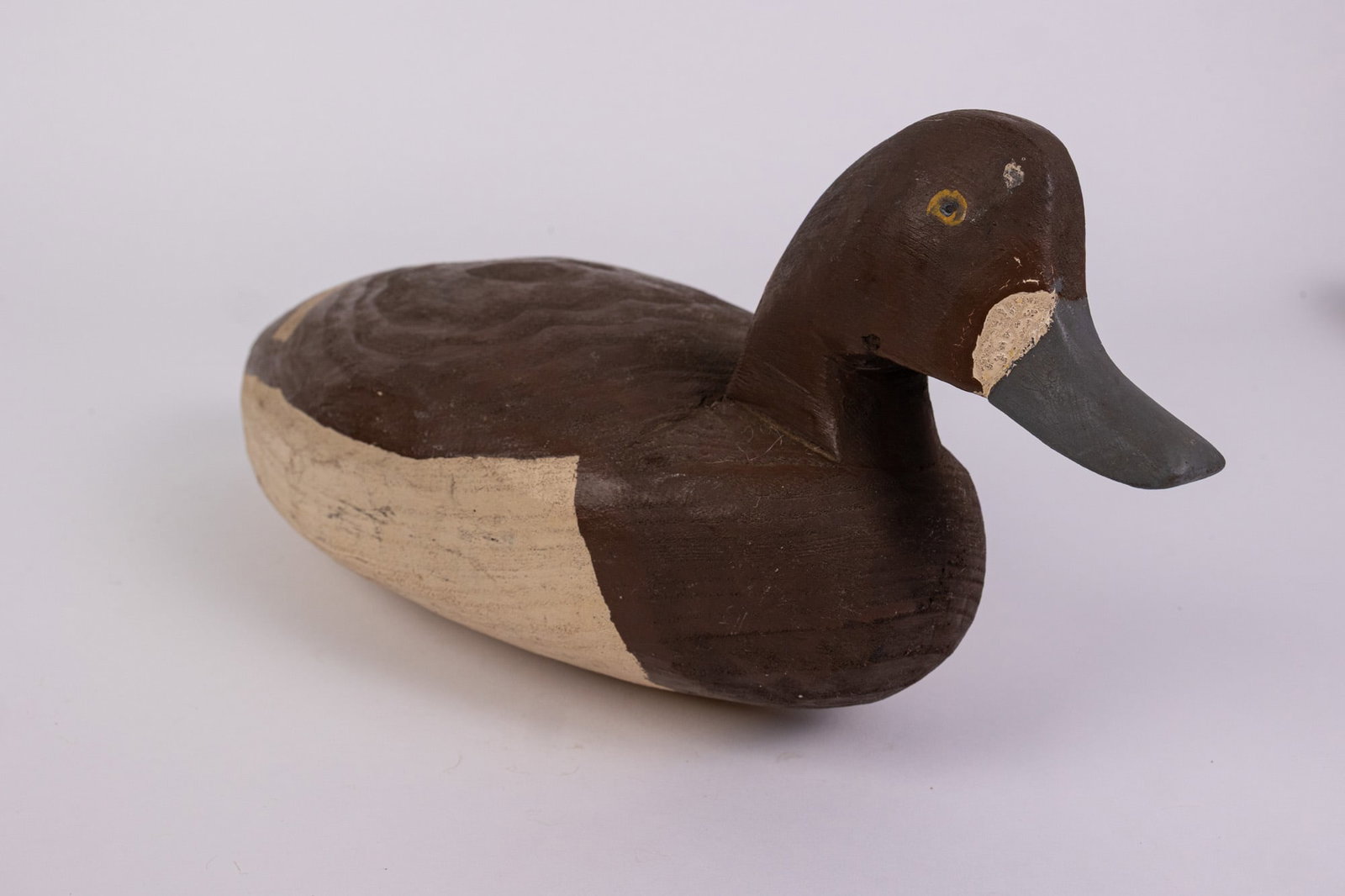 Vintage Bluebill Hen Duck Decoy: Hand painted and carved from wood. Unsigned. Some signs of wear/age in the paint. Size 6" x 16" x 7" Literature Brooks Auction – Online Auction Terms & Conditions Contact: (856) 694-2960 | info