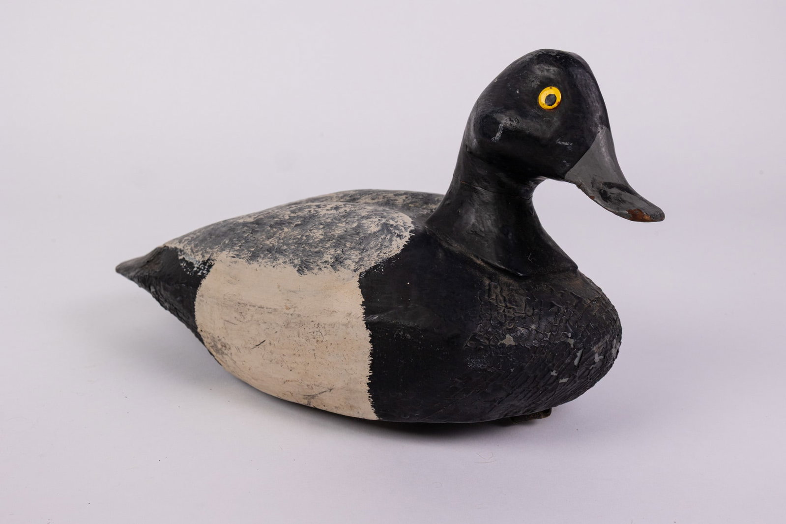 Vintage Bluebill Drake Duck Decoy: Hand painted and carved from wood. Unsigned. Some wear to the paint. Size 7" x 6" x 12" Literature Brooks Auction – Online Auction Terms & Conditions Contact: (856) 694-2960 | info@brooks.aucti