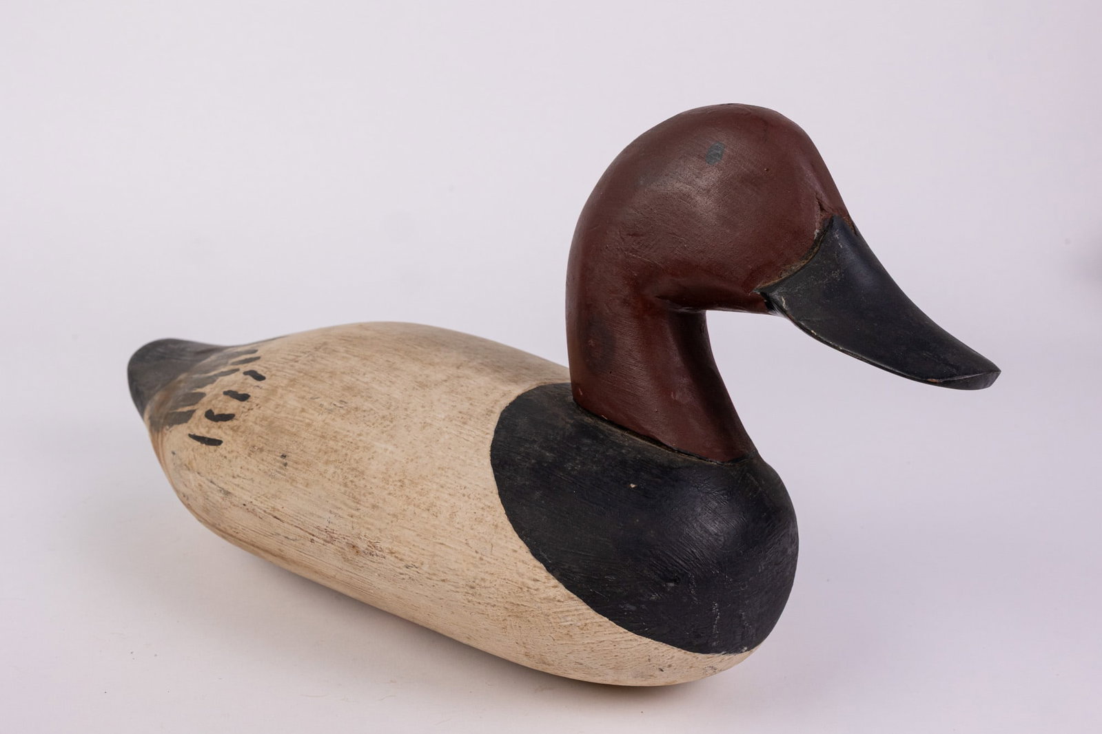 Vintage Canvasback Drake Duck Decoy: Hand painted and carved from wood. Unsigned. Size 8" x 7" x 13" Literature Brooks Auction – Online Auction Terms & Conditions Contact: (856) 694-2960 | info@brooks.auction READ BEFORE YOU BID: