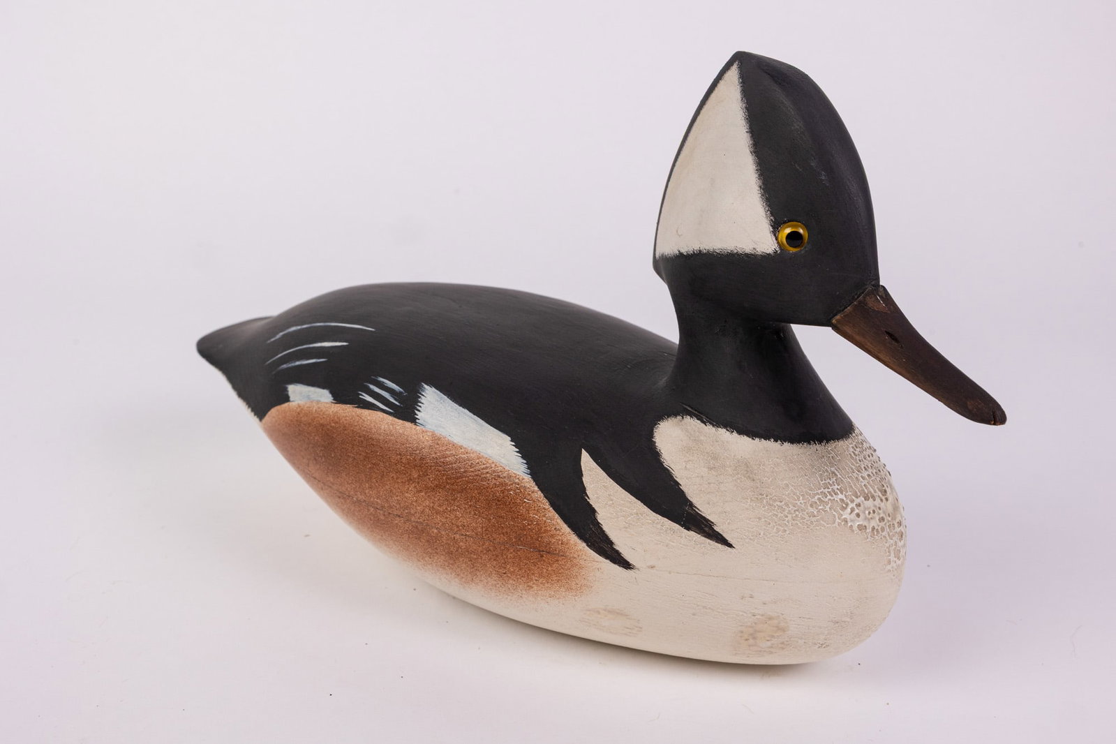 Vintage Hooded Merganser Drake Duck Decoy: Unsigned, w/ glass eyes & featuring high quality hand painted detail. Size 8" x 5" x 12" Literature Brooks Auction – Online Auction Terms & Conditions Contact: (856) 694-2960 | info@brooks.auct