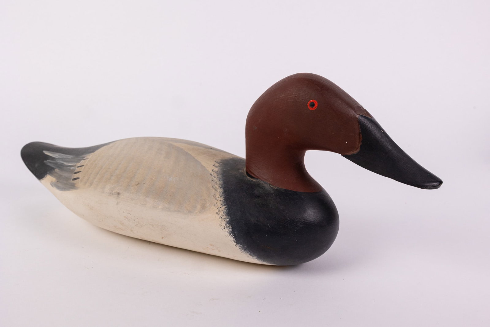 Vintage Canvasback Drake Duck Decoy: Unsigned & featuring high quality hand painted detail. Size 6" x 6" x 16" Literature Brooks Auction – Online Auction Terms & Conditions Contact: (856) 694-2960 | info@brooks.auction READ BEFORE
