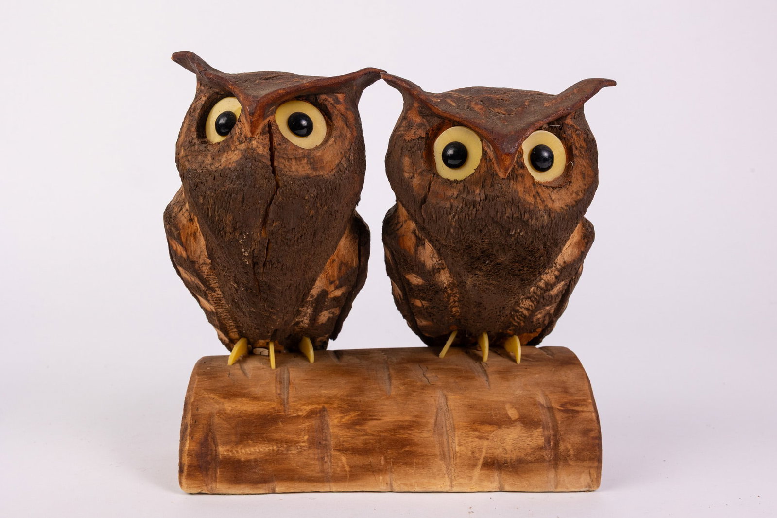 Vintage Hand-Carved Wooden Owl Figures Perchon on Half Log: Likely a pair of Great Horned Owls Size 7.5" x 7.5" x 5" Literature Brooks Auction – Online Auction Terms & Conditions Contact: (856) 694-2960 | info@brooks.auction READ BEFORE YOU BID: We want