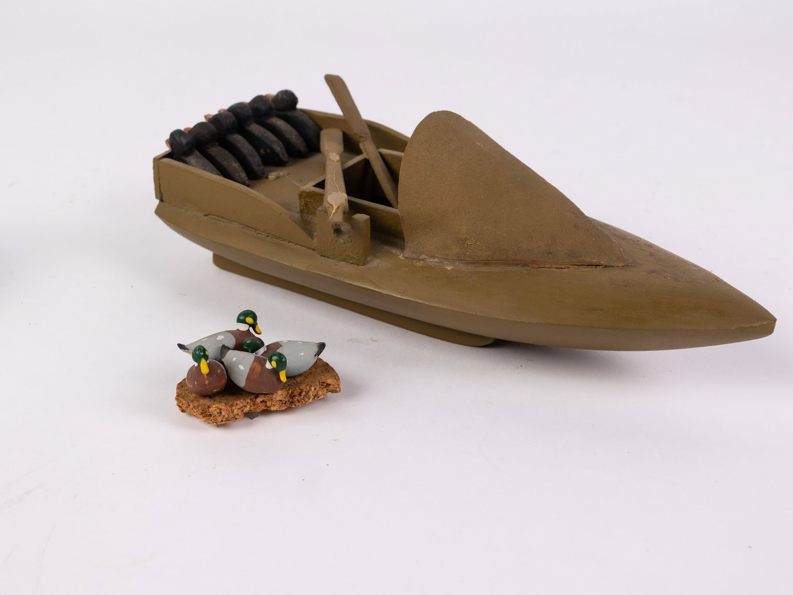 J. Fish Sr. [Absecon, NJ] "Duck Boat" 1984 Folk Art Sculpture: Hand carved sculpture of a boat filled with miniature mallards and black ducks. Signed on bottom. Size 3" x 9" x 4" Literature Brooks Auction – Online Auction Terms & Conditions Contact: (856)