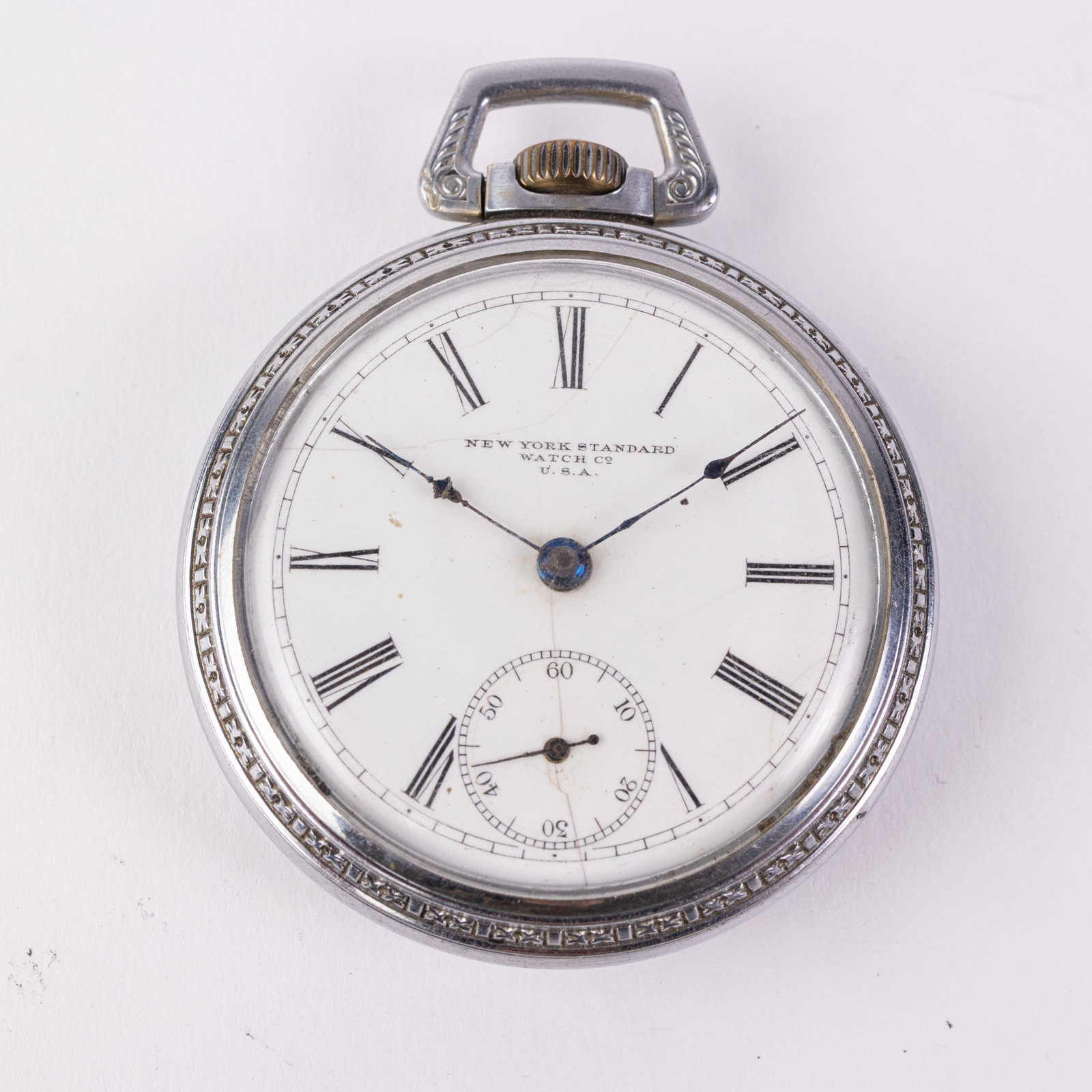 Antique N.Y. Standard Watch Co. Open Face Pocket Watch: The inner caseback is marked "Keystone Co Base Metal". The movement is marked "New York Standard Watch Co. U.S.A. Safety Pinion 1202833". The dial is marked "N.Y. Standard Watch Co. U.S.A.".