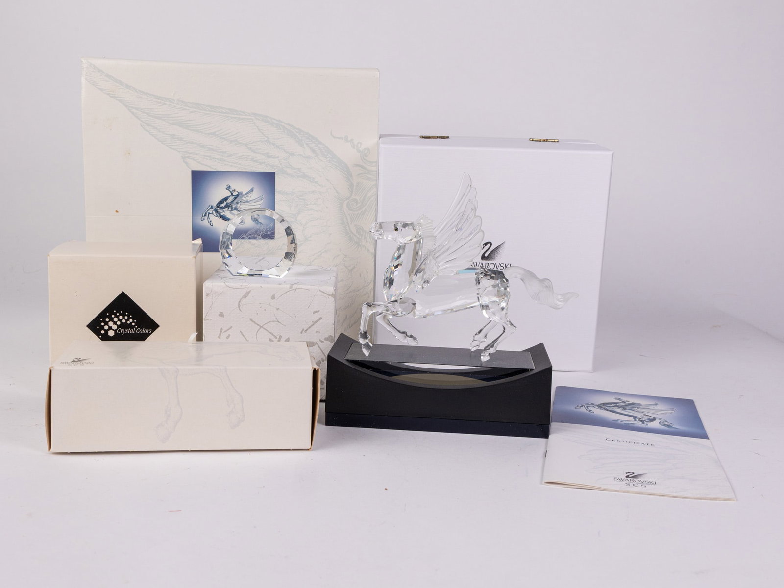 Swarovski "Fabulous Creatures" Crystal Pegasus IOB with Display: Swarovski "Fabulous Creatures" Crystal Pegasus IOB with display stand and plaque Size 5" H Literature Brooks Auction – Online Auction Terms & Conditions Contact: (856) 694-2960 |