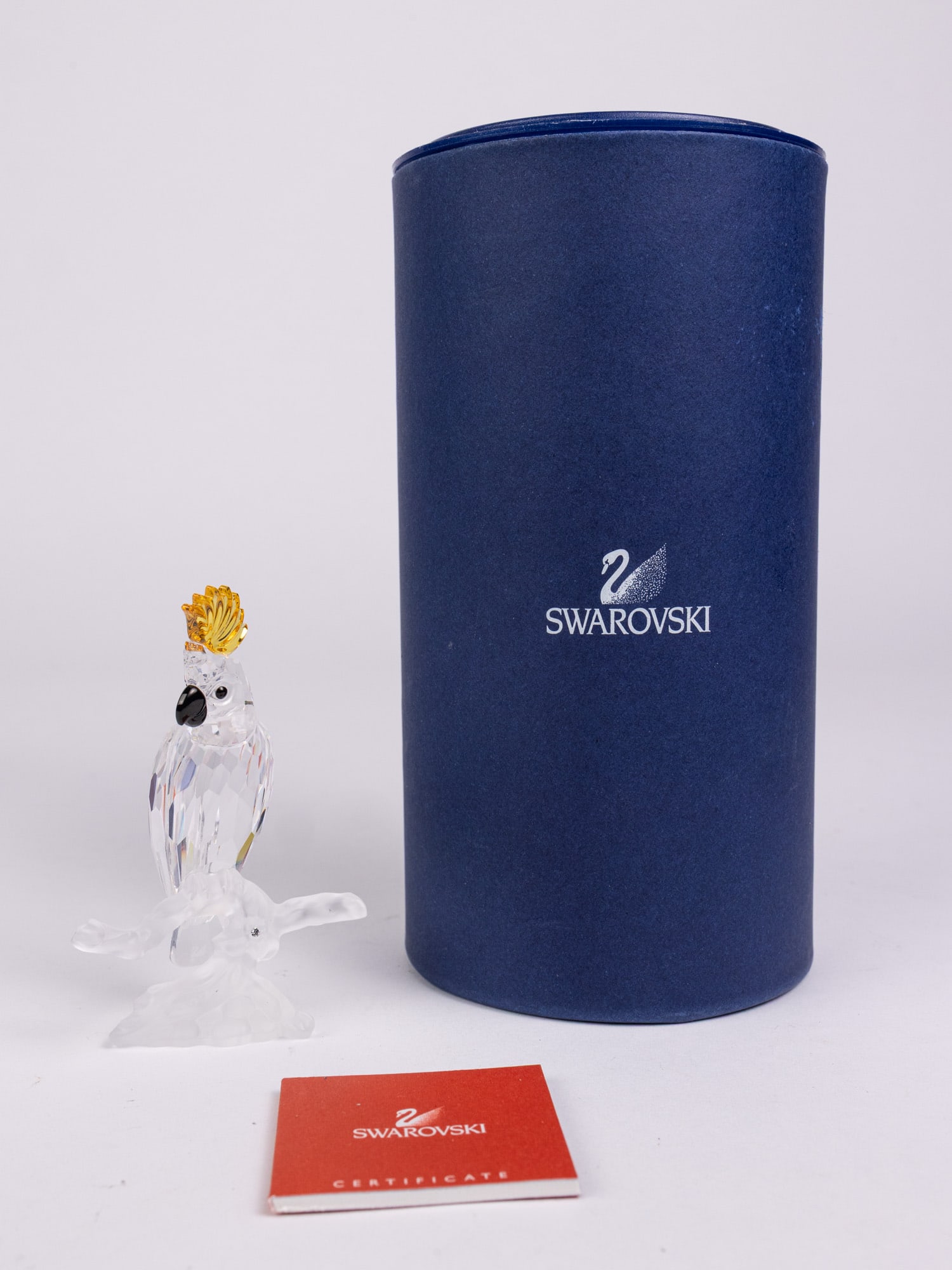Swarovski " Cockatoo " Silver Crystal Figurine IOB: Swarovski " Cockatoo " Silver Crystal Figurine IOB Size 3"H Literature Brooks Auction – Online Auction Terms & Conditions Contact: (856) 694-2960 | info@brooks.auction READ BEFORE YOU BID: We