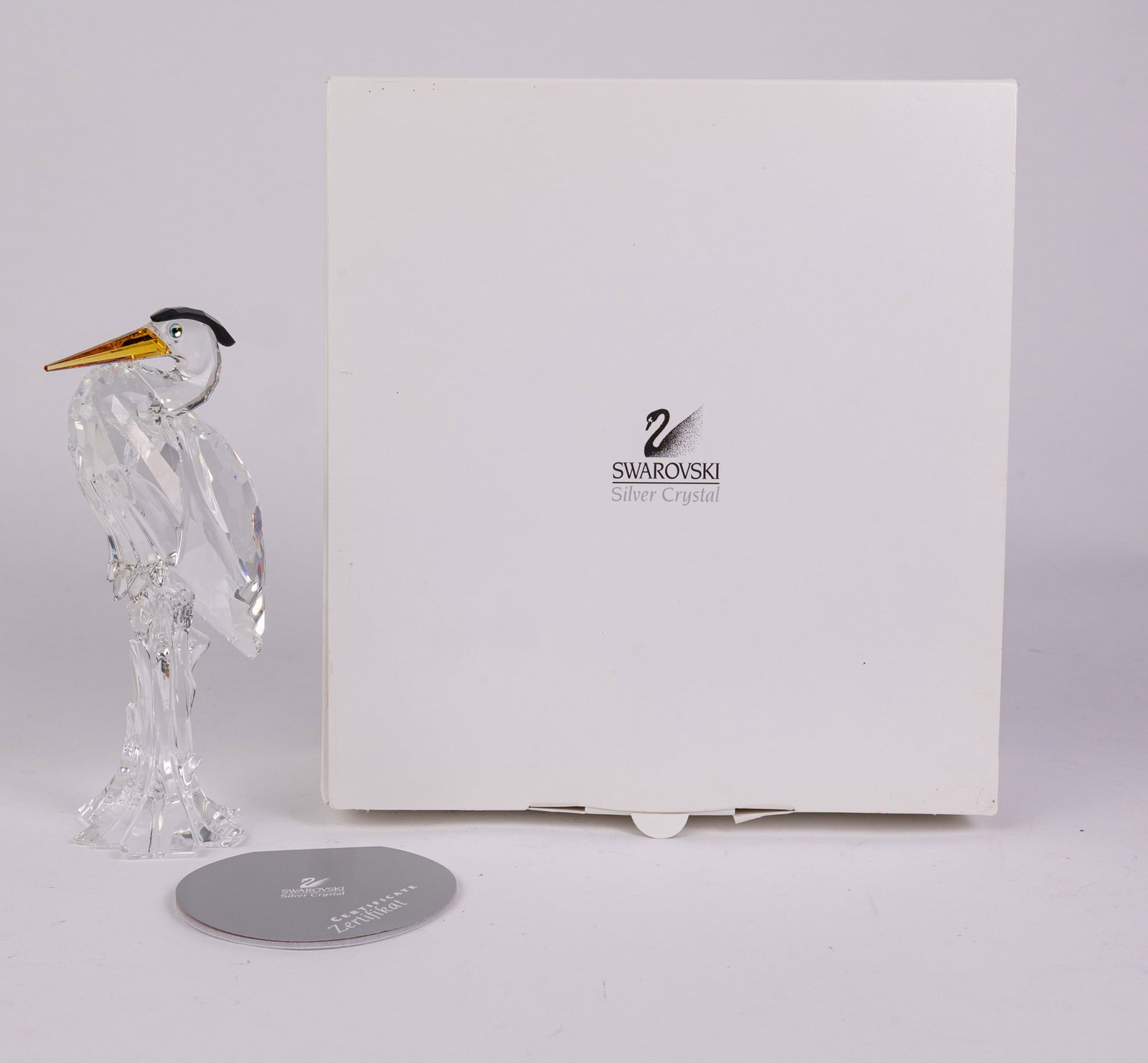 Swarovski Crystal Silver Heron IOB: Swarovski Crystal Silver Heron IOB Size 6" H Literature Brooks Auction – Online Auction Terms & Conditions Contact: (856) 694-2960 | info@brooks.auction READ BEFORE YOU BID: We want you to feel