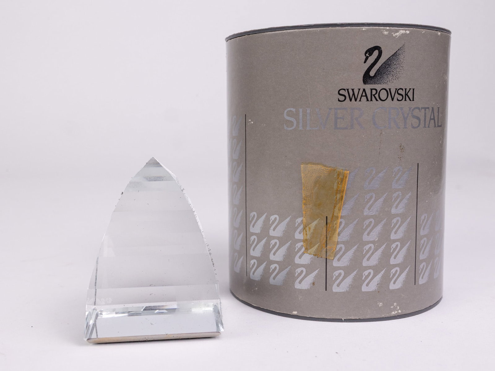 Swarovski Silver Crystal Clear Pyramid Paperweight IOB: Swarovski Silver Crystal Clear Pyramid Paperweight IOB Size 2.5" H Literature Brooks Auction – Online Auction Terms & Conditions Contact: (856) 694-2960 | info@brooks.auction READ BEFORE YOU