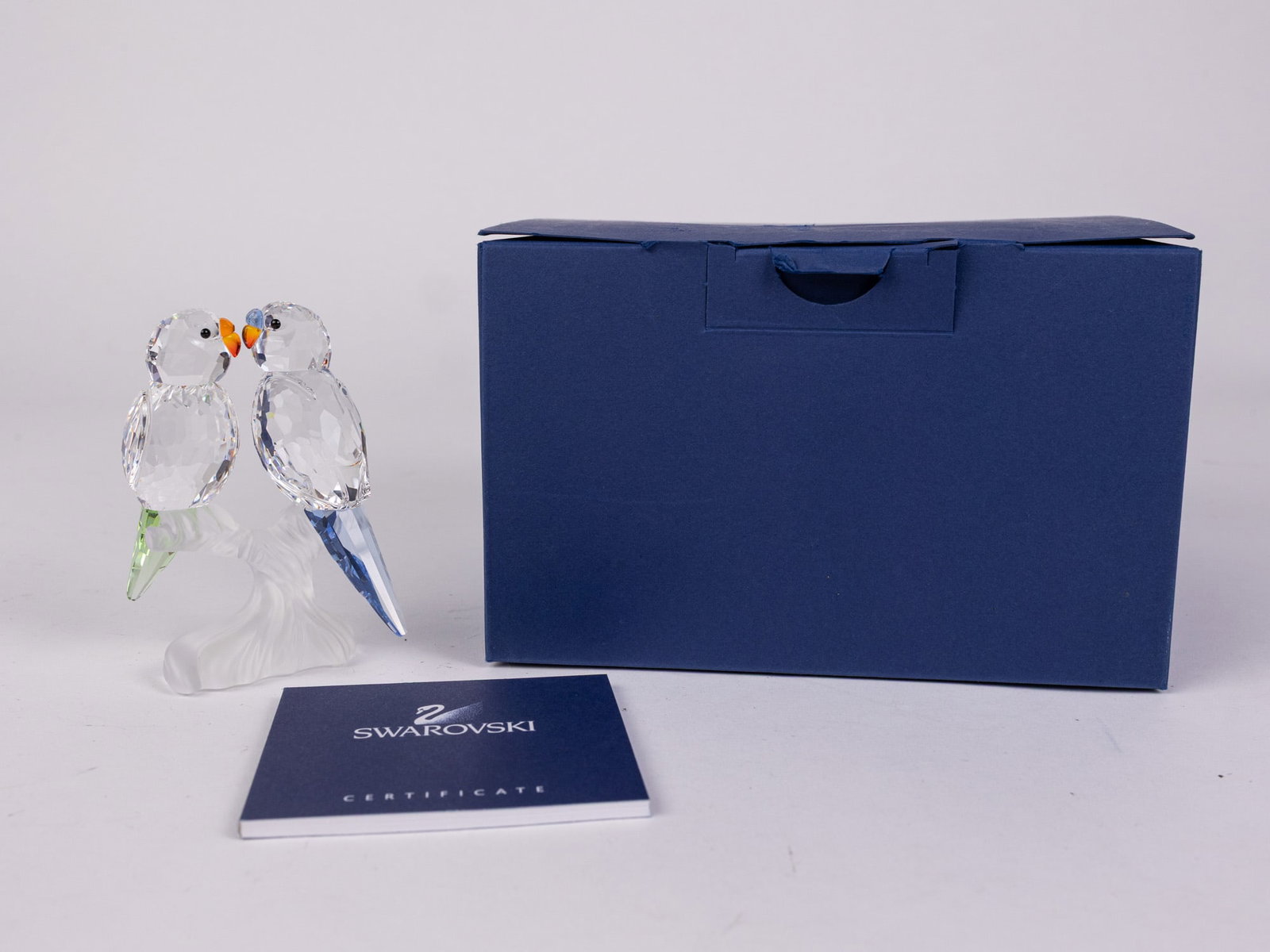 Swarovski Crystal Budgies Parakeets IOB: Swarovski Crystal Budgies Parakeets IOB Size 3.5" H Literature Brooks Auction – Online Auction Terms & Conditions Contact: (856) 694-2960 | info@brooks.auction READ BEFORE YOU BID: We wa