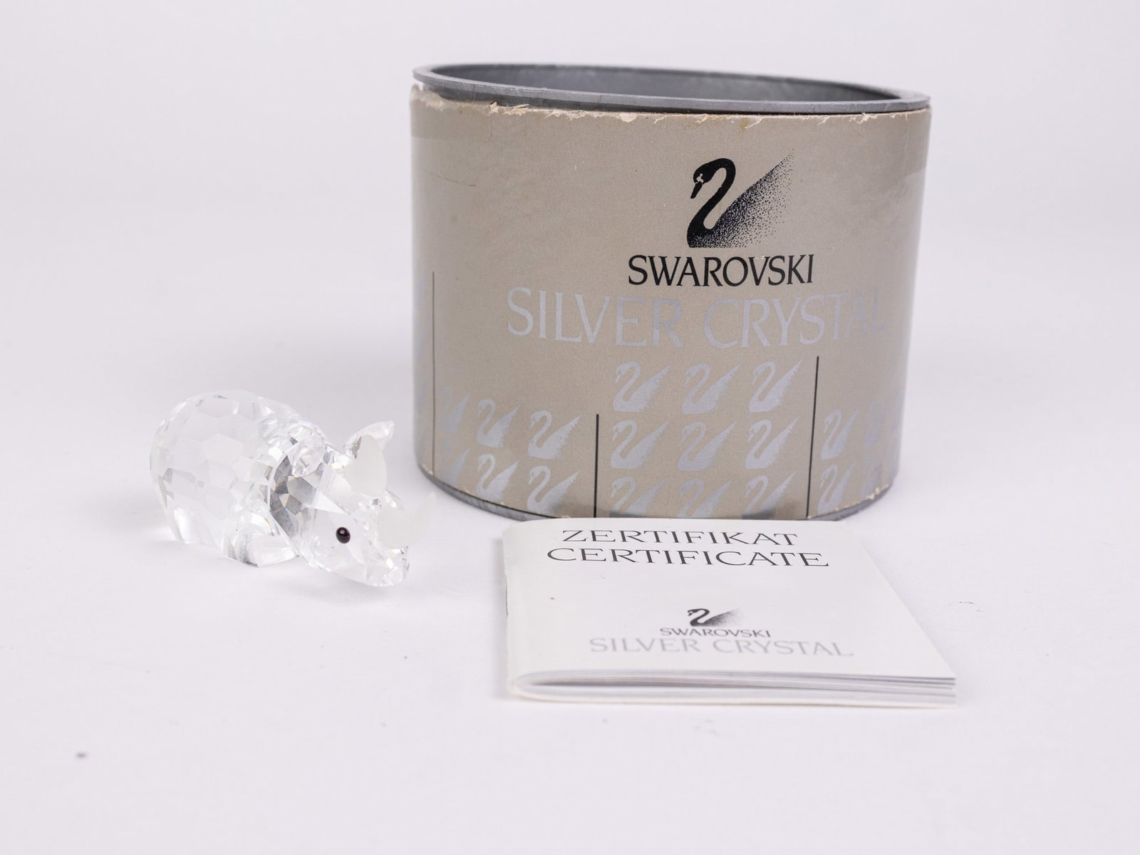 Swarovski "Rhinoceros " Silver Crystal Figurine IOB: Swarovski "Rhinoceros " Silver Crystal Figurine IOB Size 1" H Literature Brooks Auction – Online Auction Terms & Conditions Contact: (856) 694-2960 | info@brooks.auction READ BEFORE YOU BID: