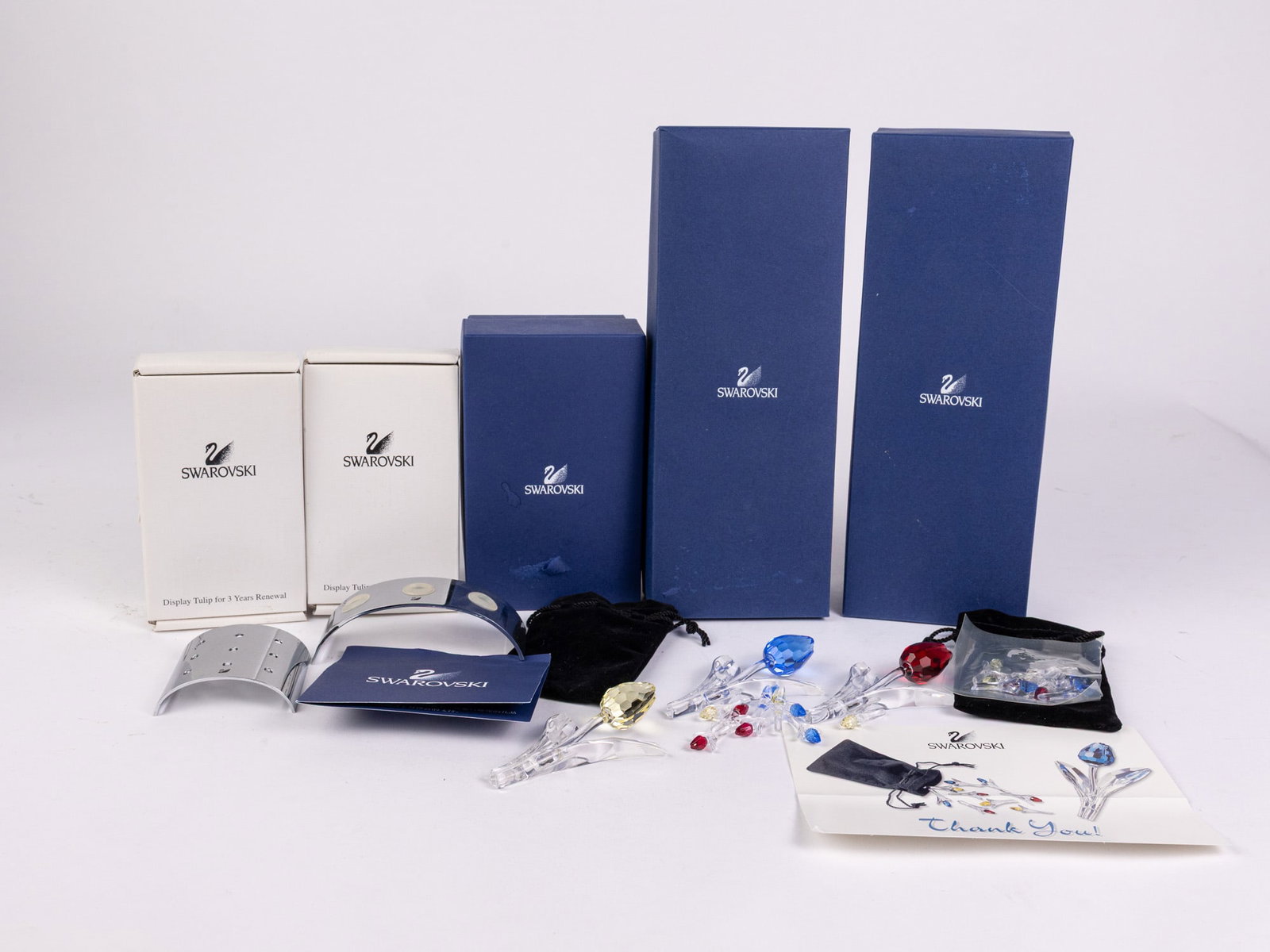 Swarovski Crystal Society Tulips with Display Stands IOB: Swarovski Crystal Society Tulips with Display Stand and miniatures IOB Size 3.5" Literature Brooks Auction – Online Auction Terms & Conditions Contact: (856) 694-2960 | info@brooks.auction READ