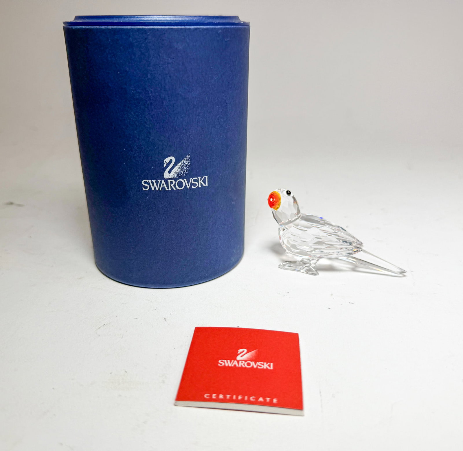 Swarovski Crystal Parrot IOB: Swarovski Crystal Parrot IOB Size 1.75" H Literature Brooks Auction – Online Auction Terms & Conditions Contact: (856) 694-2960 | info@brooks.auction READ BEFORE YOU BID: We want you to