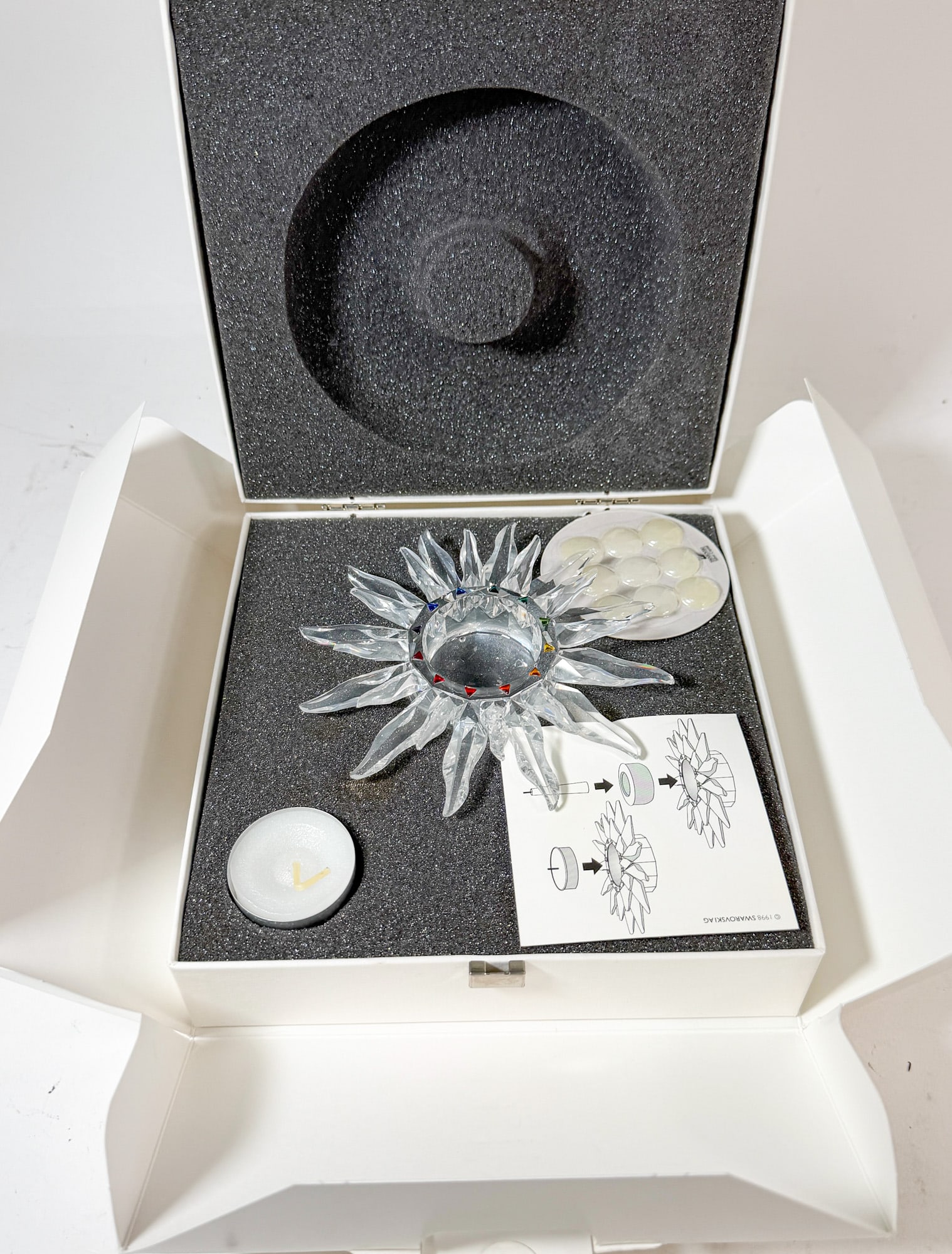 Swarovski Crystal Solaris Candle Holder IOB: Swarovski Crystal Solaris Candle Holder IOB Size 5.5" Diameter Literature Brooks Auction – Online Auction Terms & Conditions Contact: (856) 694-2960 | info@brooks.auction READ BEFORE YOU BID